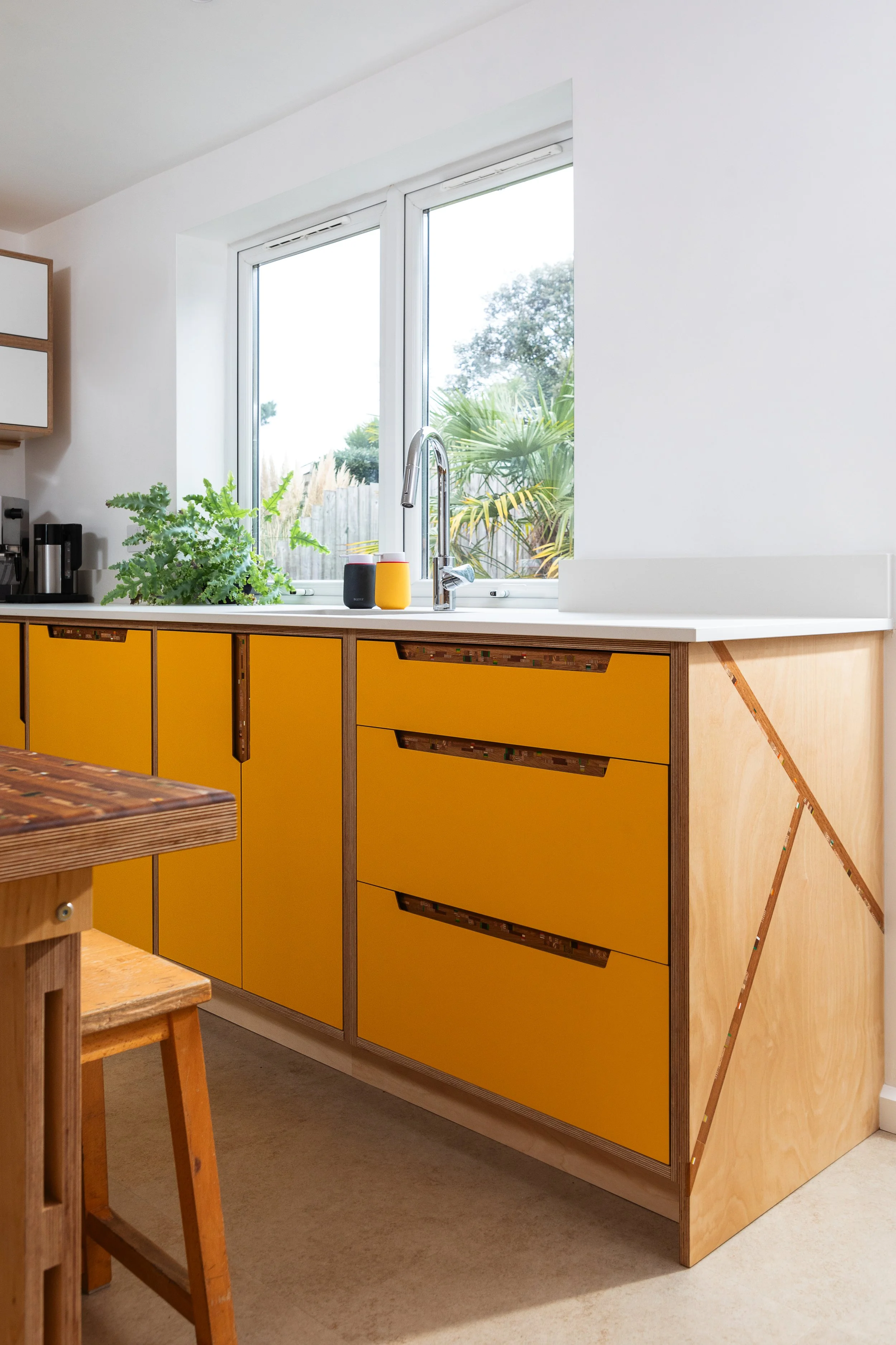 Kitchen with Marquetry Topped Table and Integrated Handles
