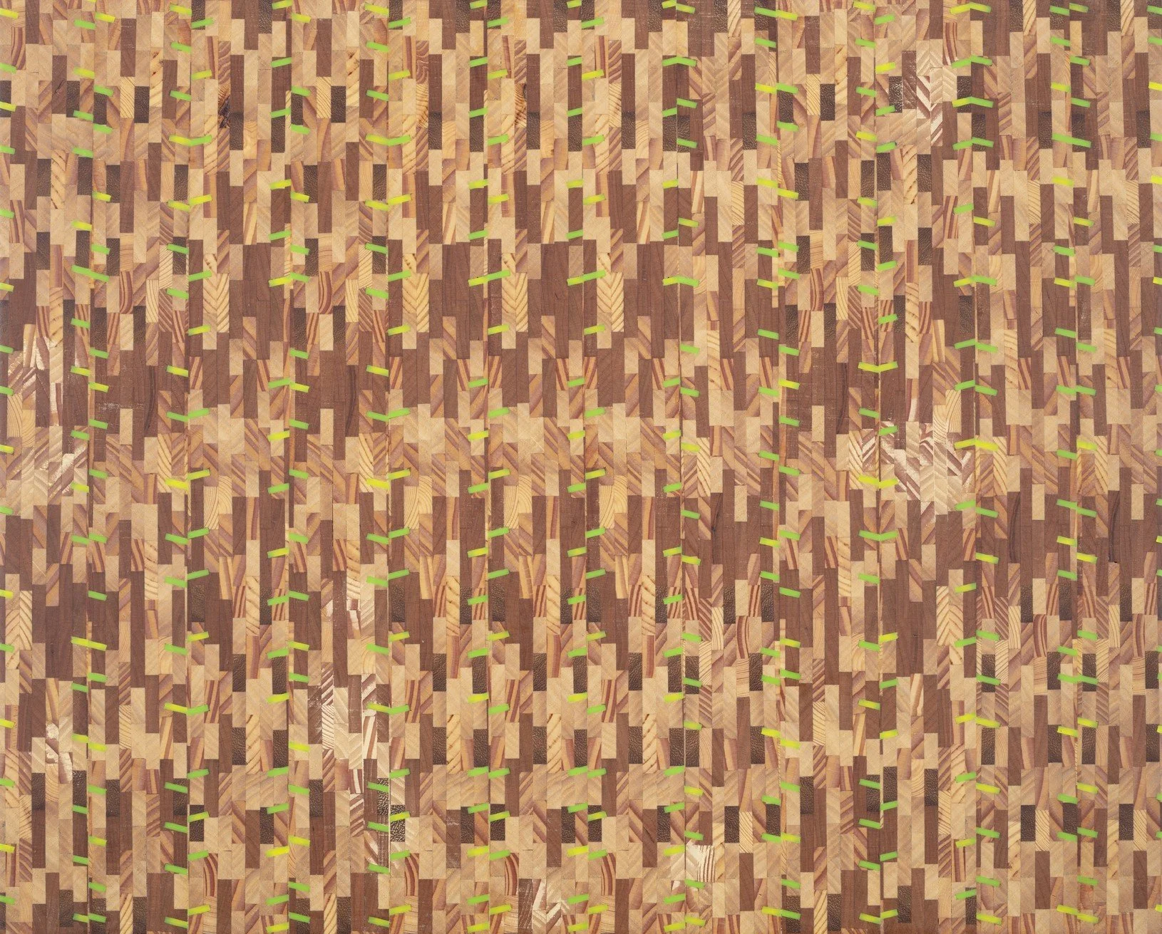 Close-up of a wooden parquet floor with neon green markers and lines arranged in a pattern.