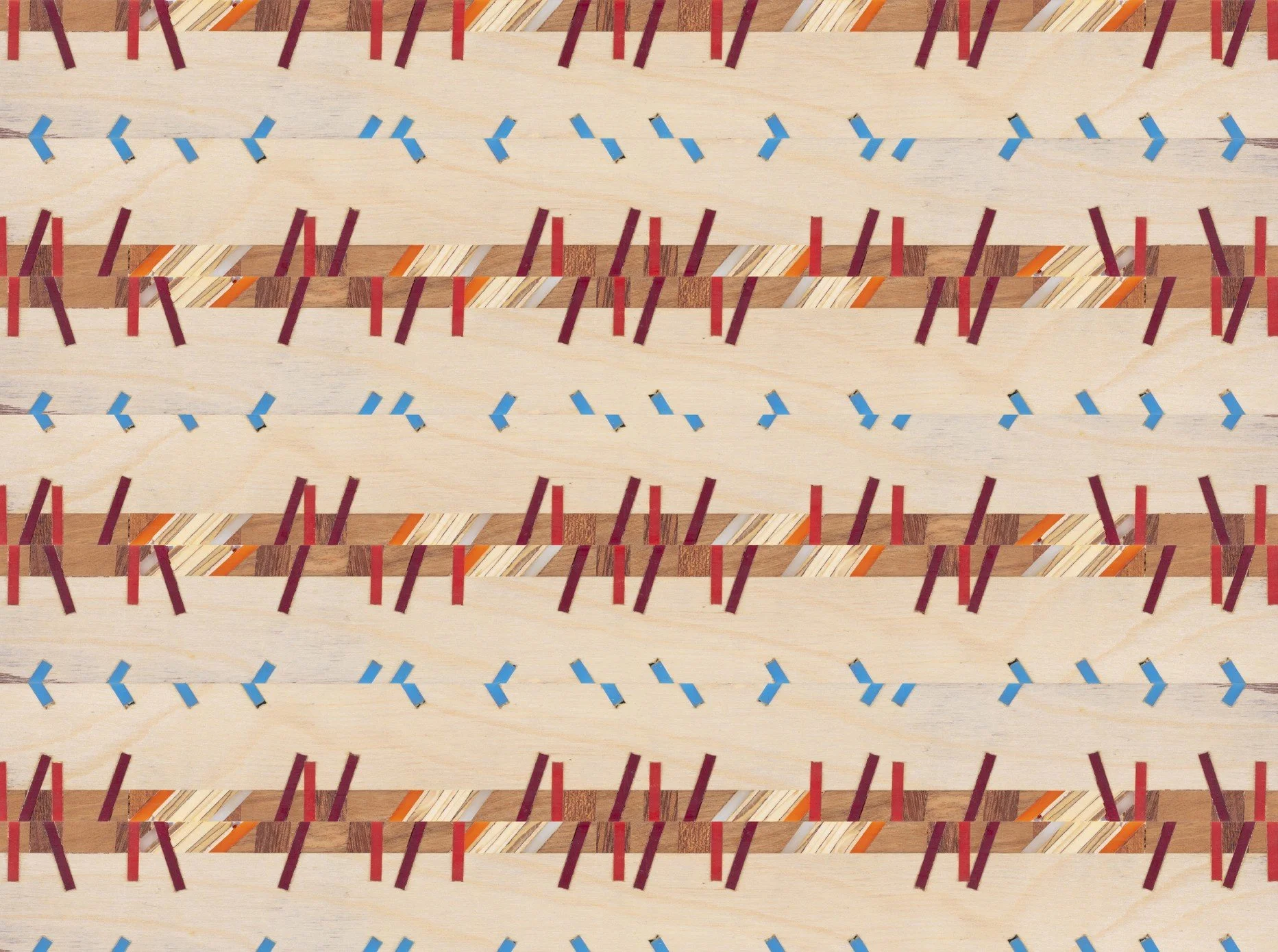 Close-up view of a wooden board with small rubber bands in red and blue rubber bands woven into it.