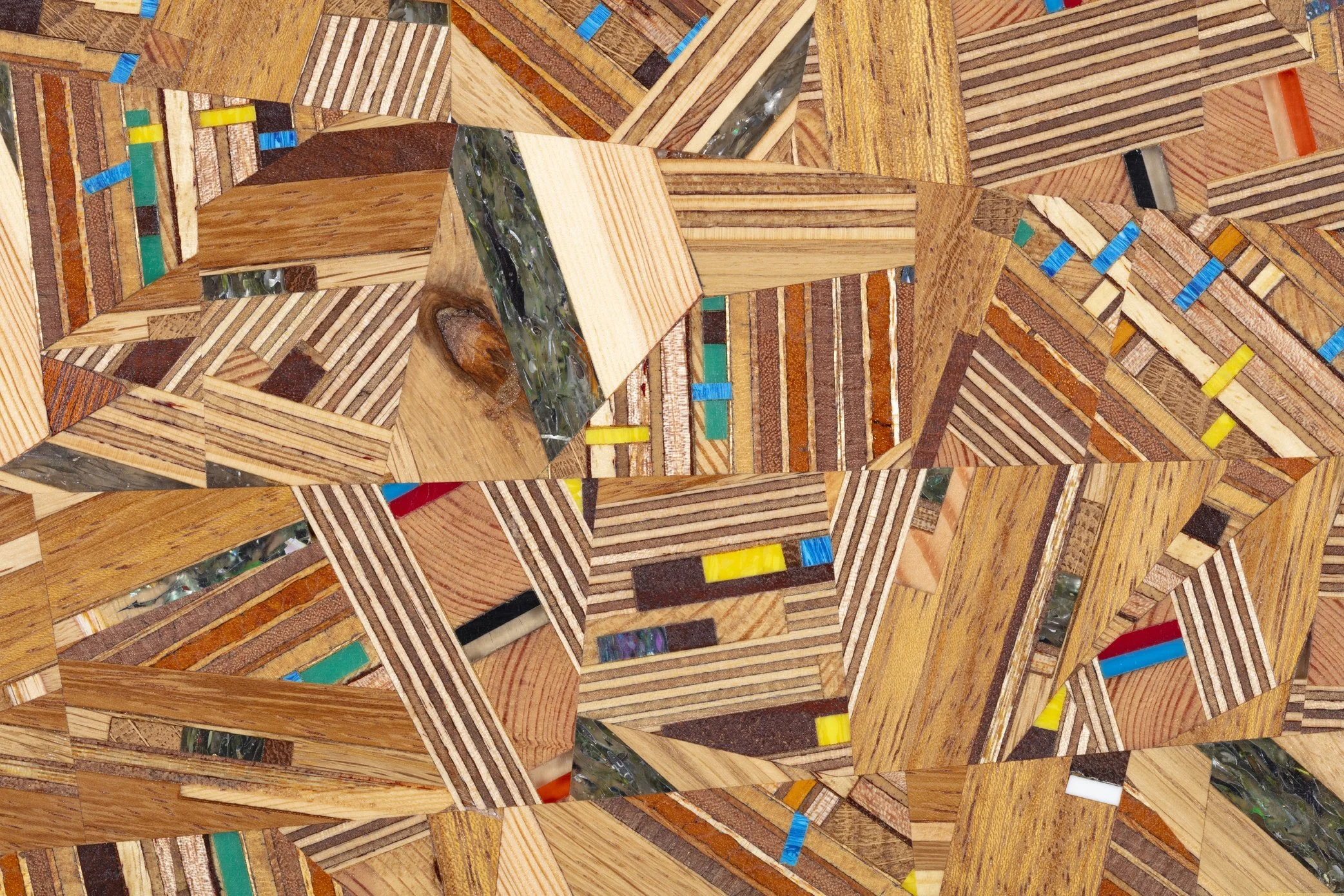 A collage of various types of wooden flooring and wood panel samples with different colors, patterns, and textures.