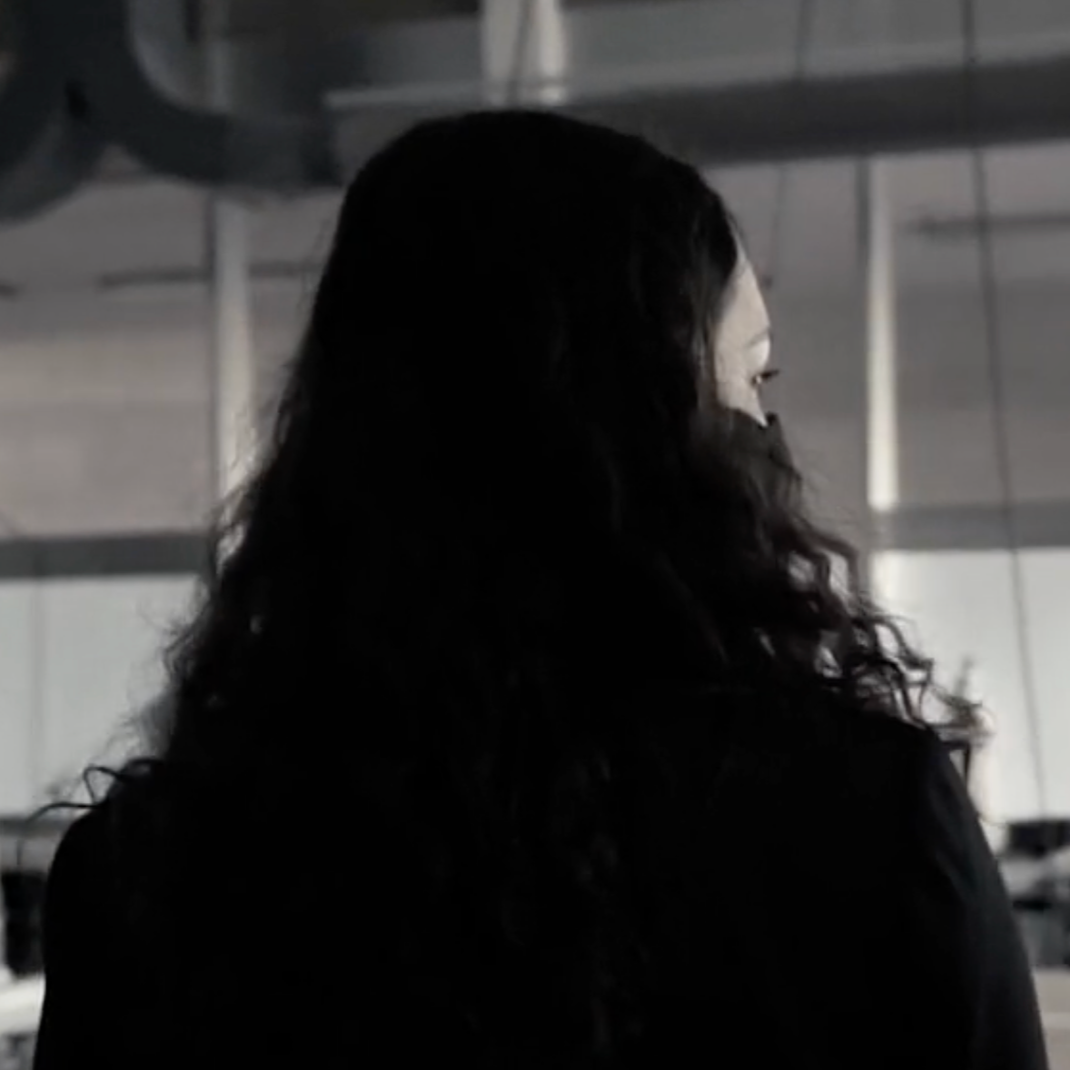Side profile of a Claire, looking off to her right.