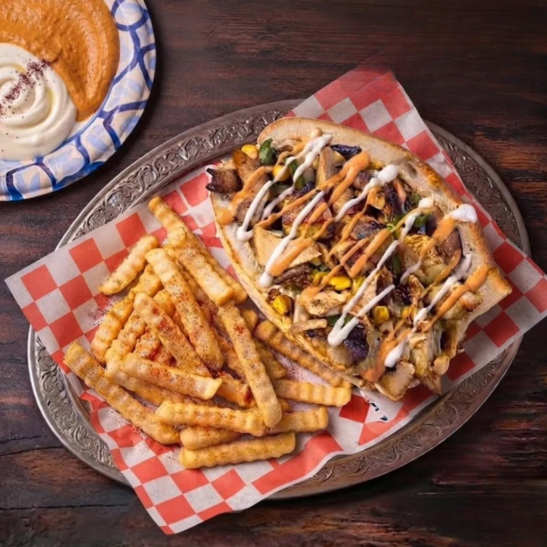 Photo of Aleppo chicken shawarma and fries from Yalla Wraps