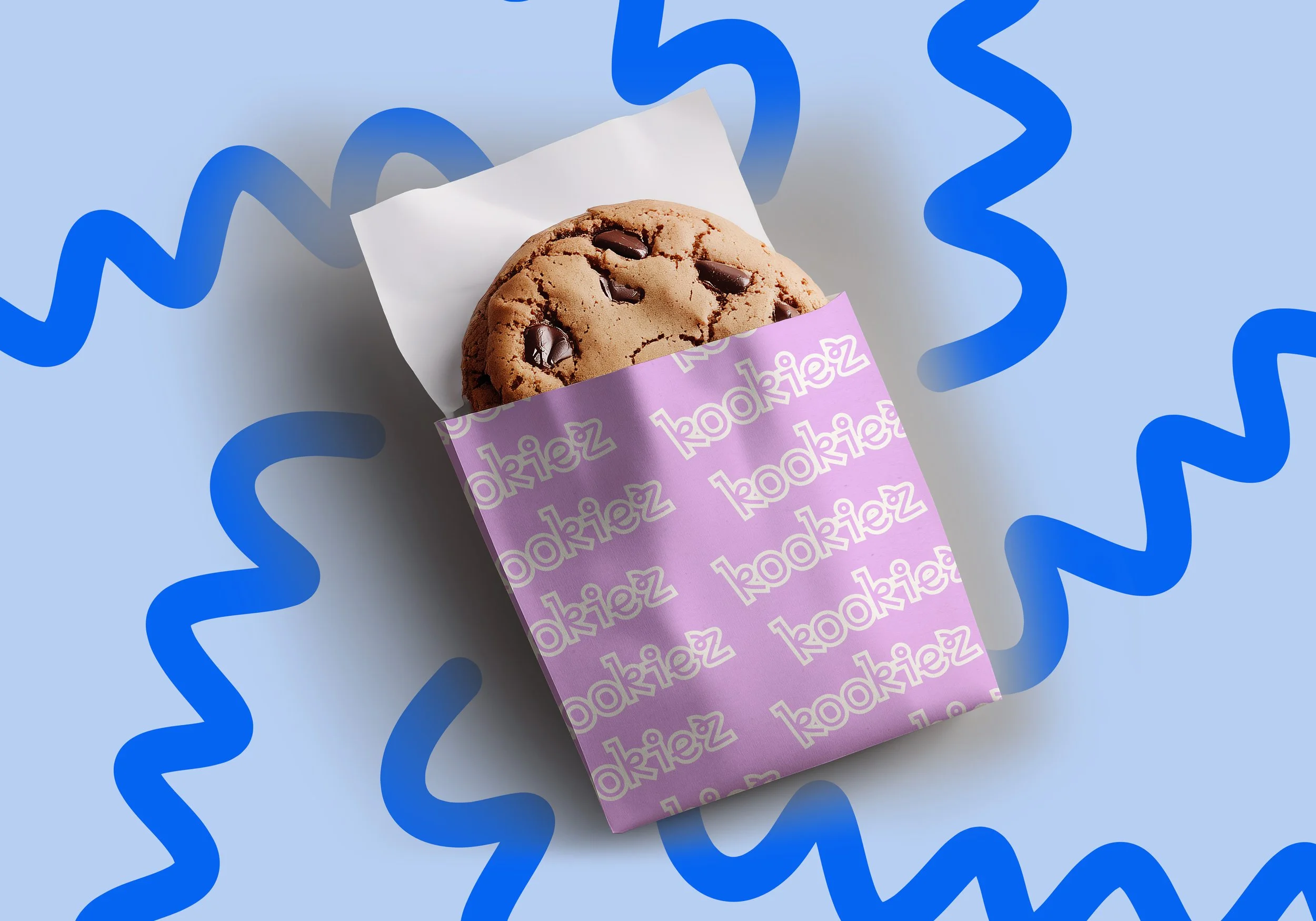 A chocolate chip cookie partially wrapped in purple paper with the word 'bookie' repeated on it, resting on a light blue background with blue curly streamers.