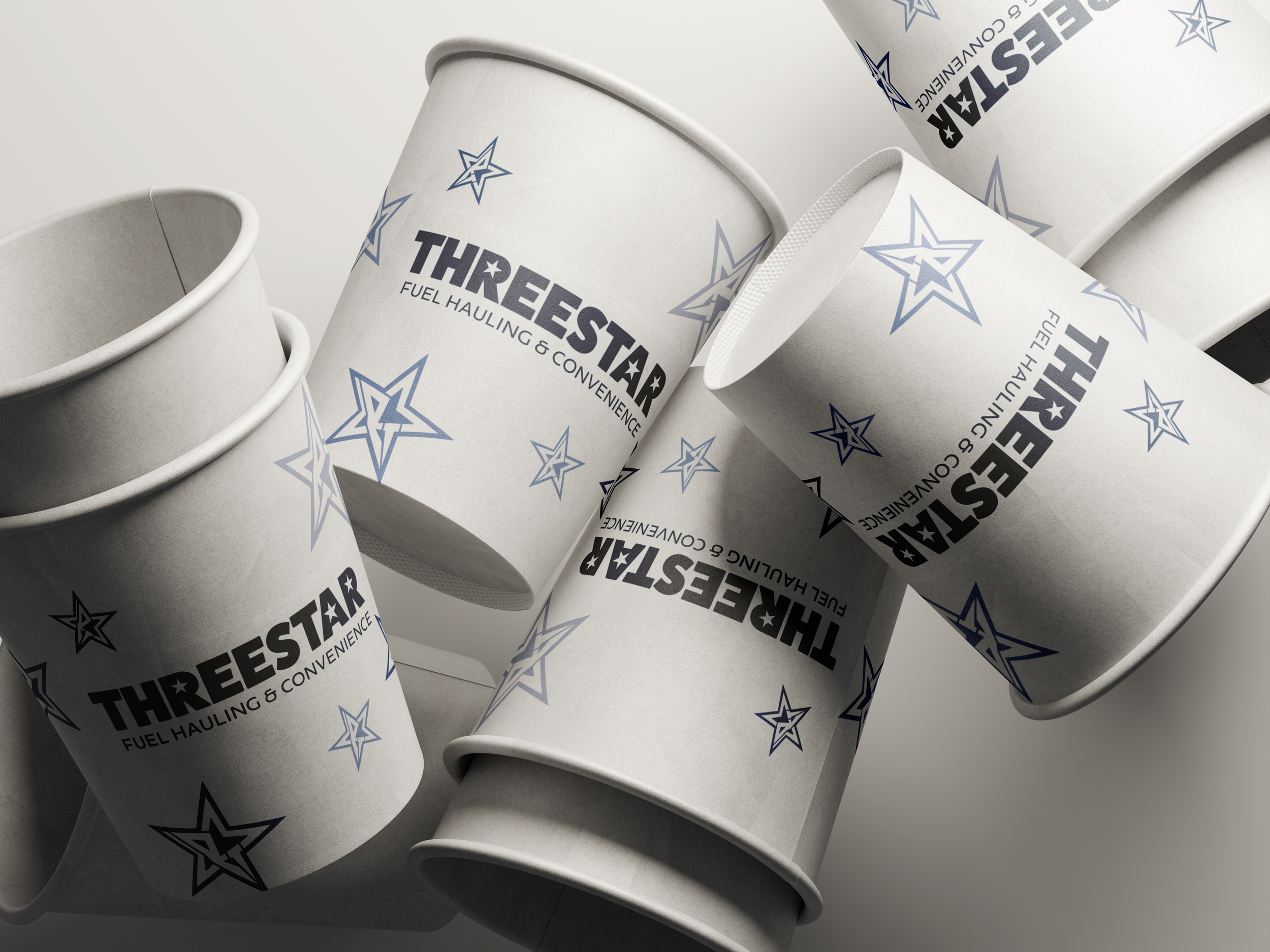 Multiple white cups with blue and black logo and text that says "THREESTAR FUEL HAULING & CONVENIENCE" surrounded by blue star graphics.