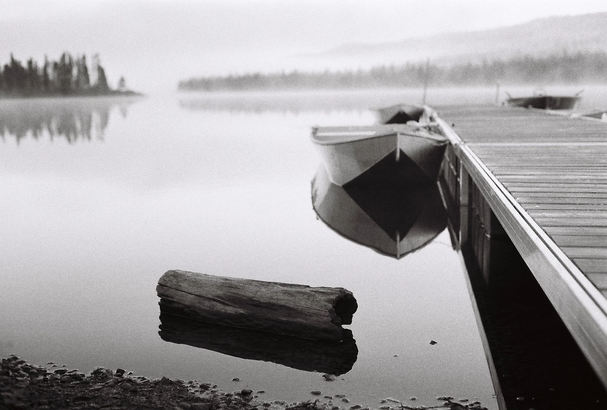 Gaspe-Peninsula QC a foggy lake with the boat at the dock