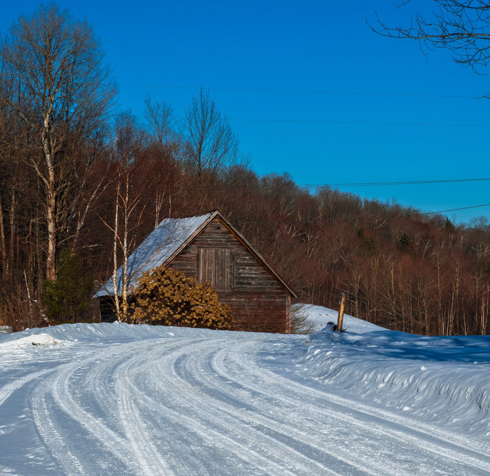Color snowy road in the mountains of Vermont.