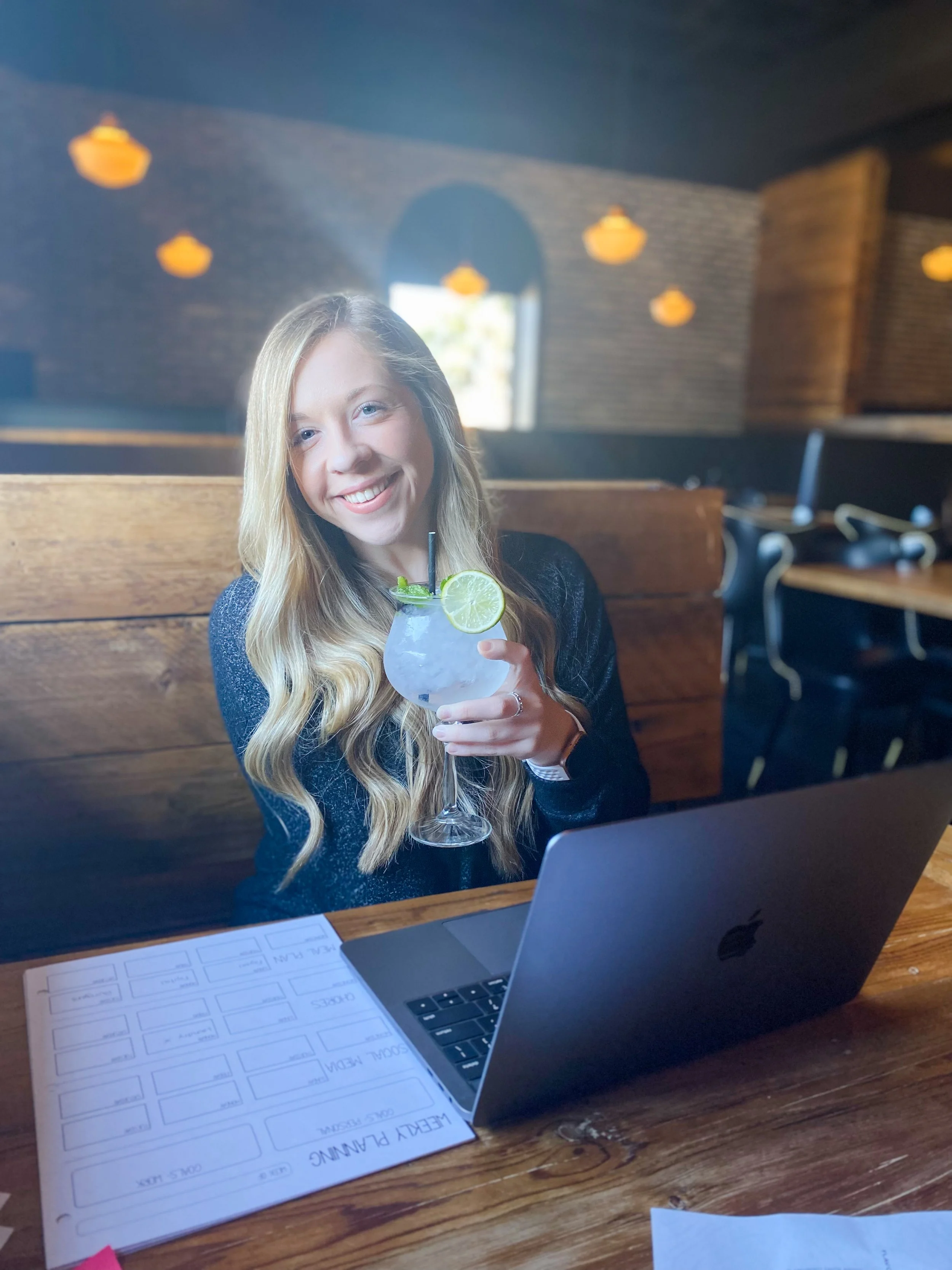 Marissa Co Owner Digital Artist Graphic Designer at AlethalWeaponArt. Drinking a gin cocktail while having a business meeting at Mezcalito Butcher in Apple Valley Minnesota.