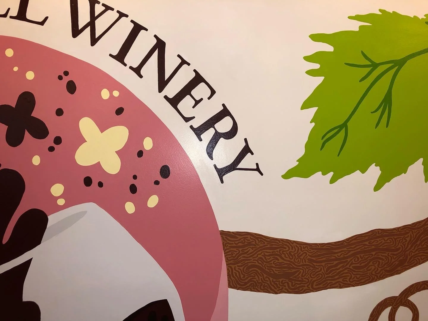 close up of emblem and branch painted on the wall