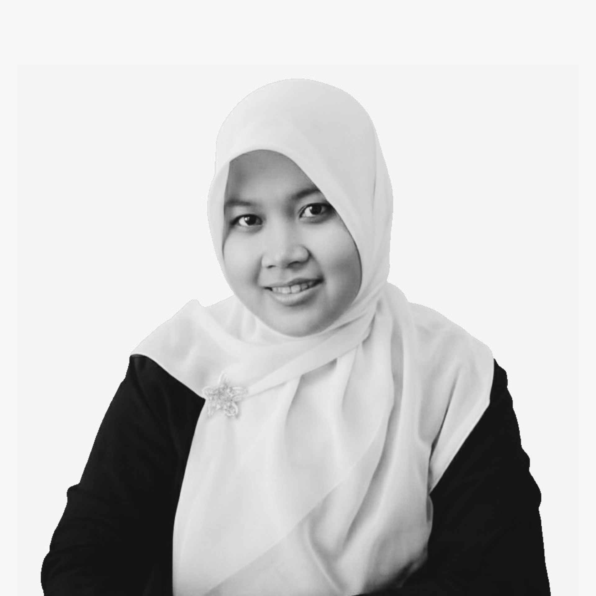 Black and white portrait of a woman wearing a hijab and a dark blazer, smiling.