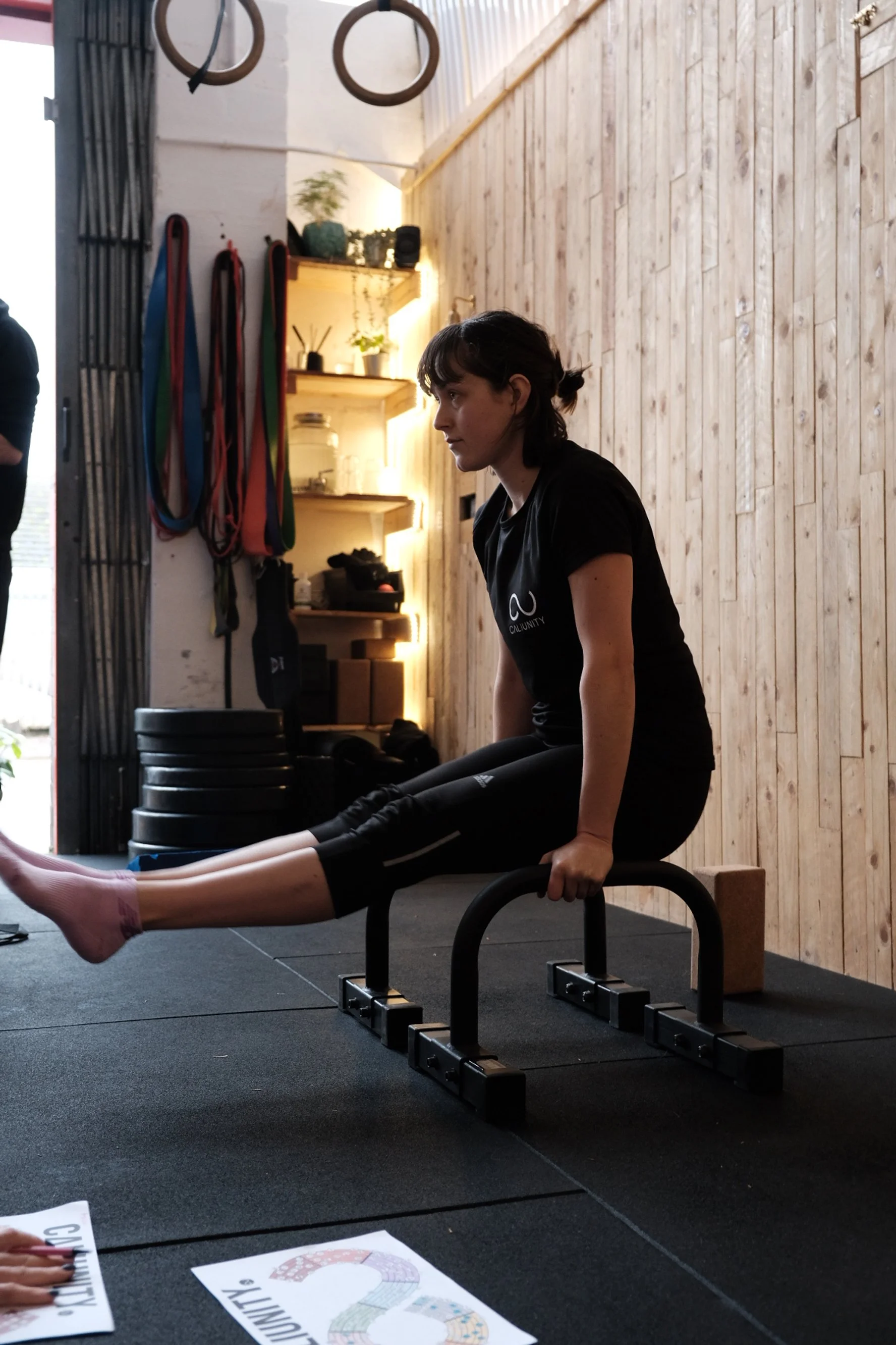 Zorana - CaliUnity member, holding an L-sit position