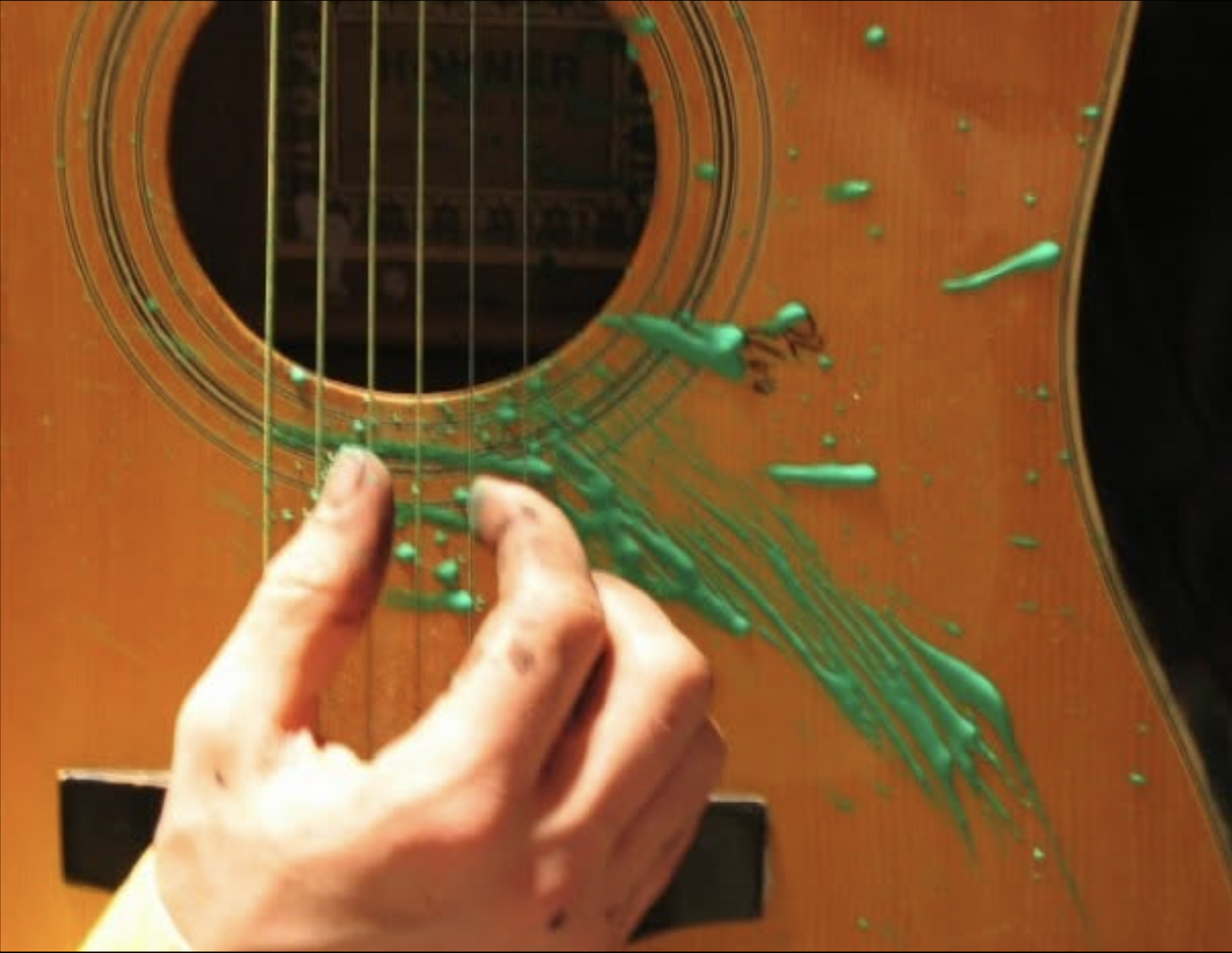 Green paint playing guitar - Elaine Ford