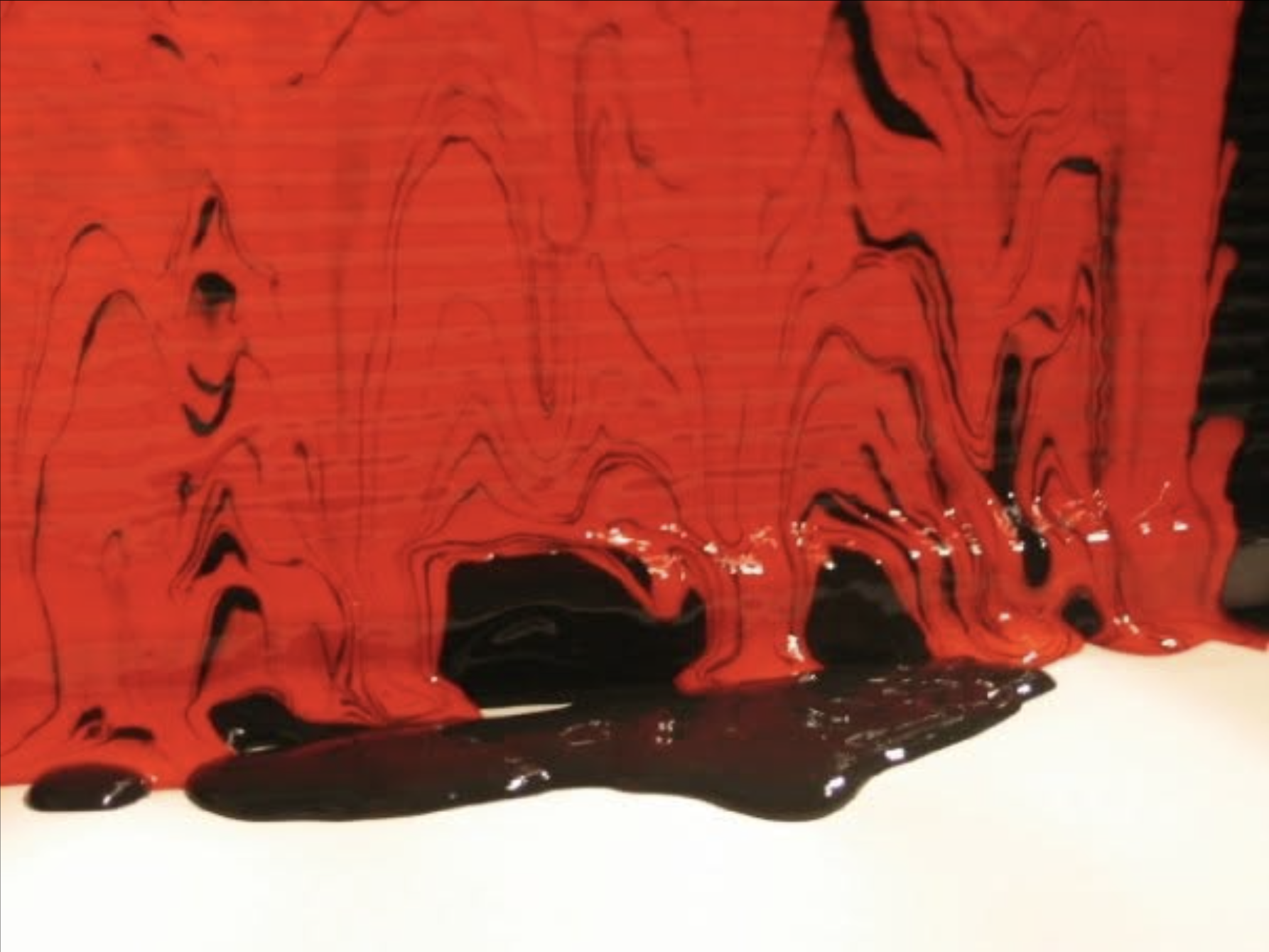 Speaker moving paint through vibrations. Elaine Ford Visual Music