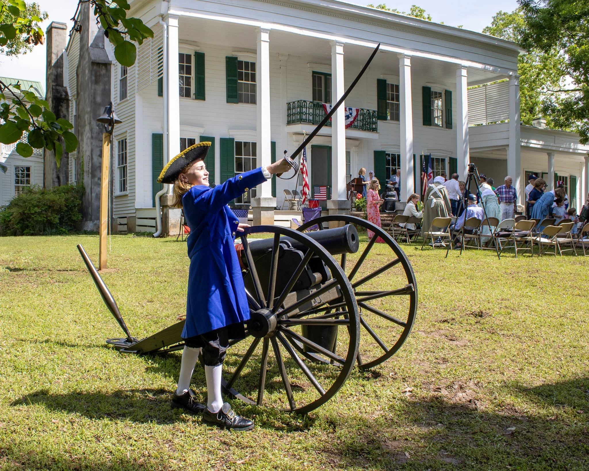 Young patriot poses next to a cannon at Cotesworth