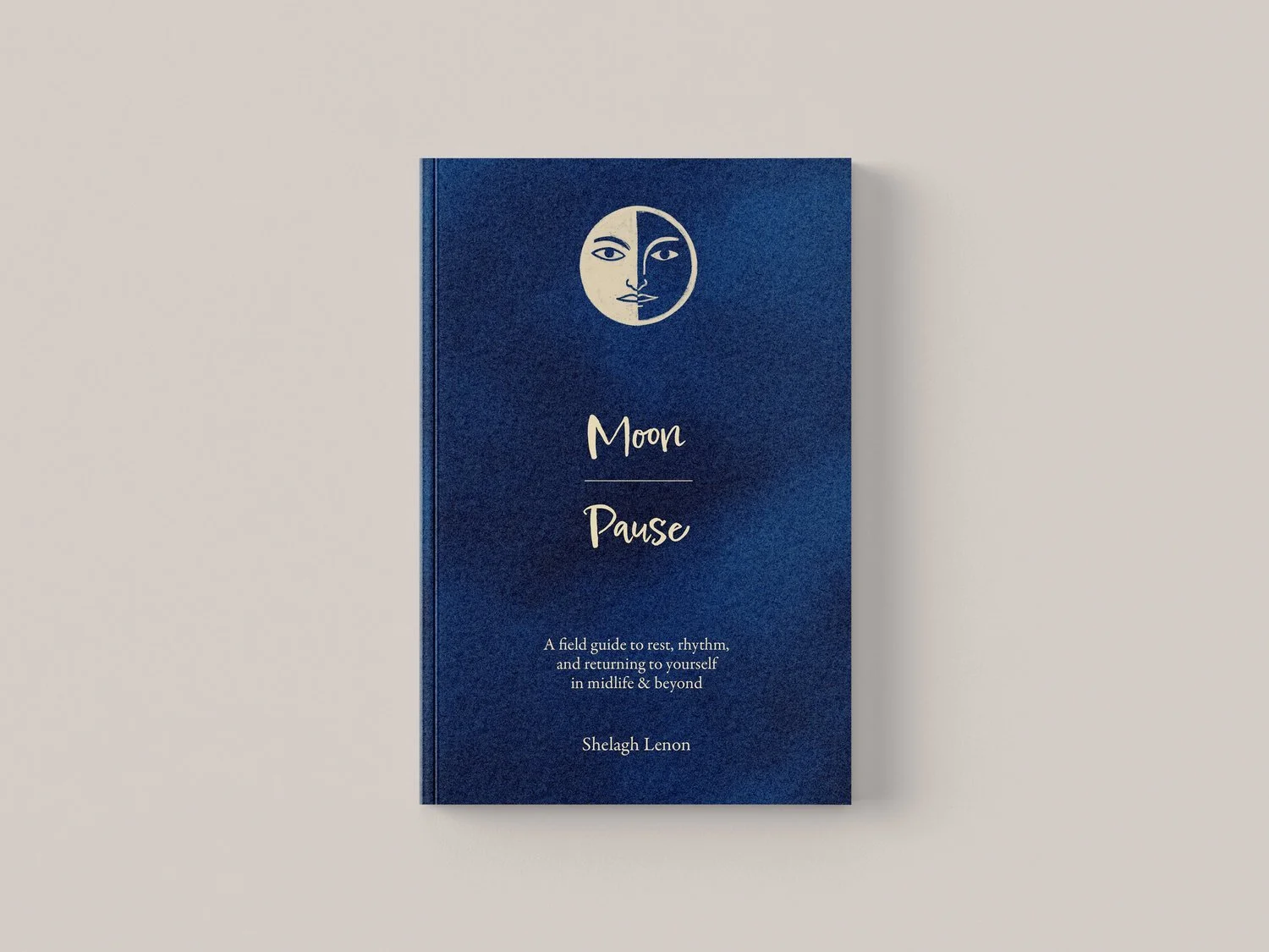 Navy blue hardcover book titled "Moon Pause" by Shelagh Lenon, a field guide to rest and rhythm in midlife
