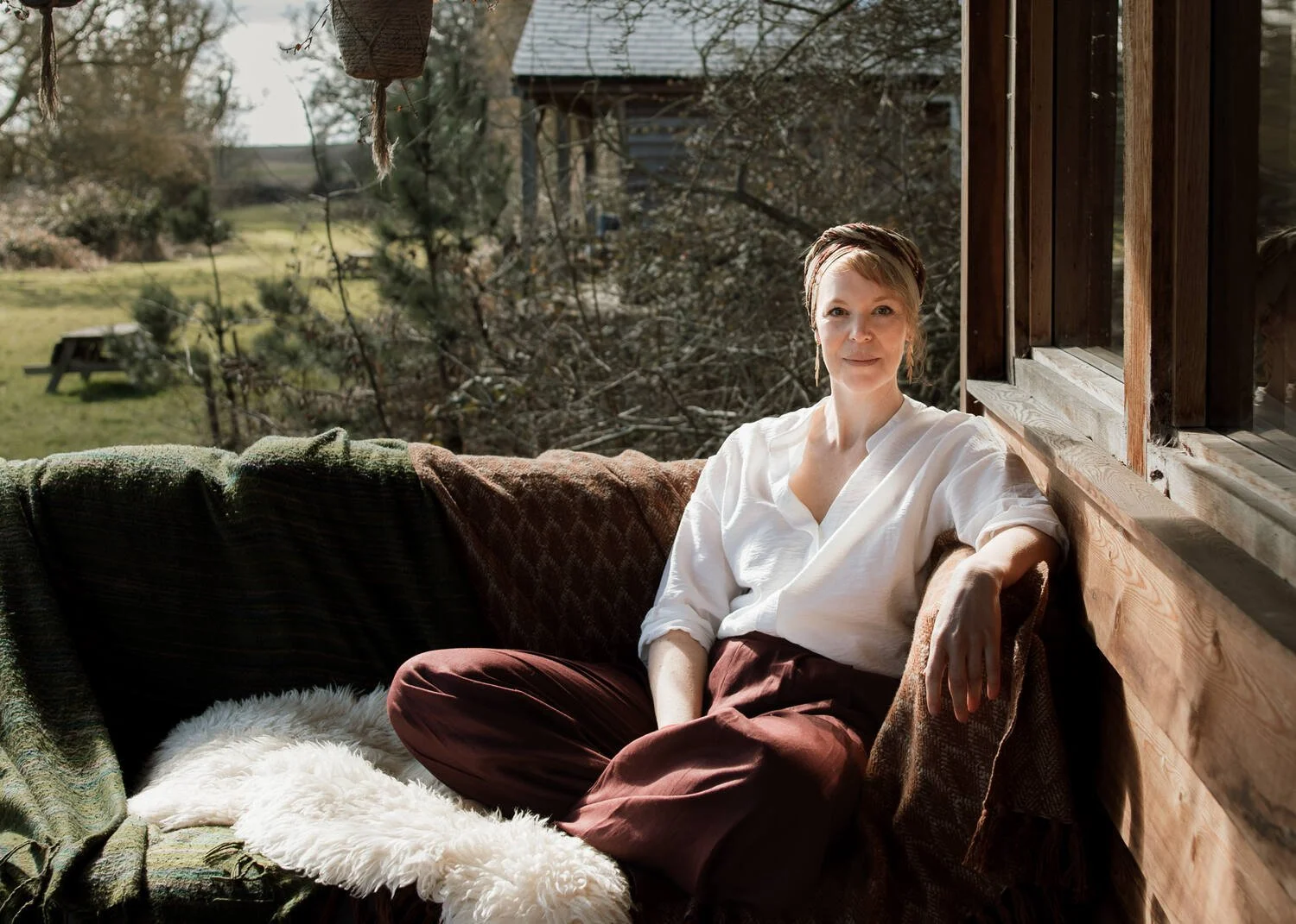 Business mentor Erika Chalkley sitting on a sofa
