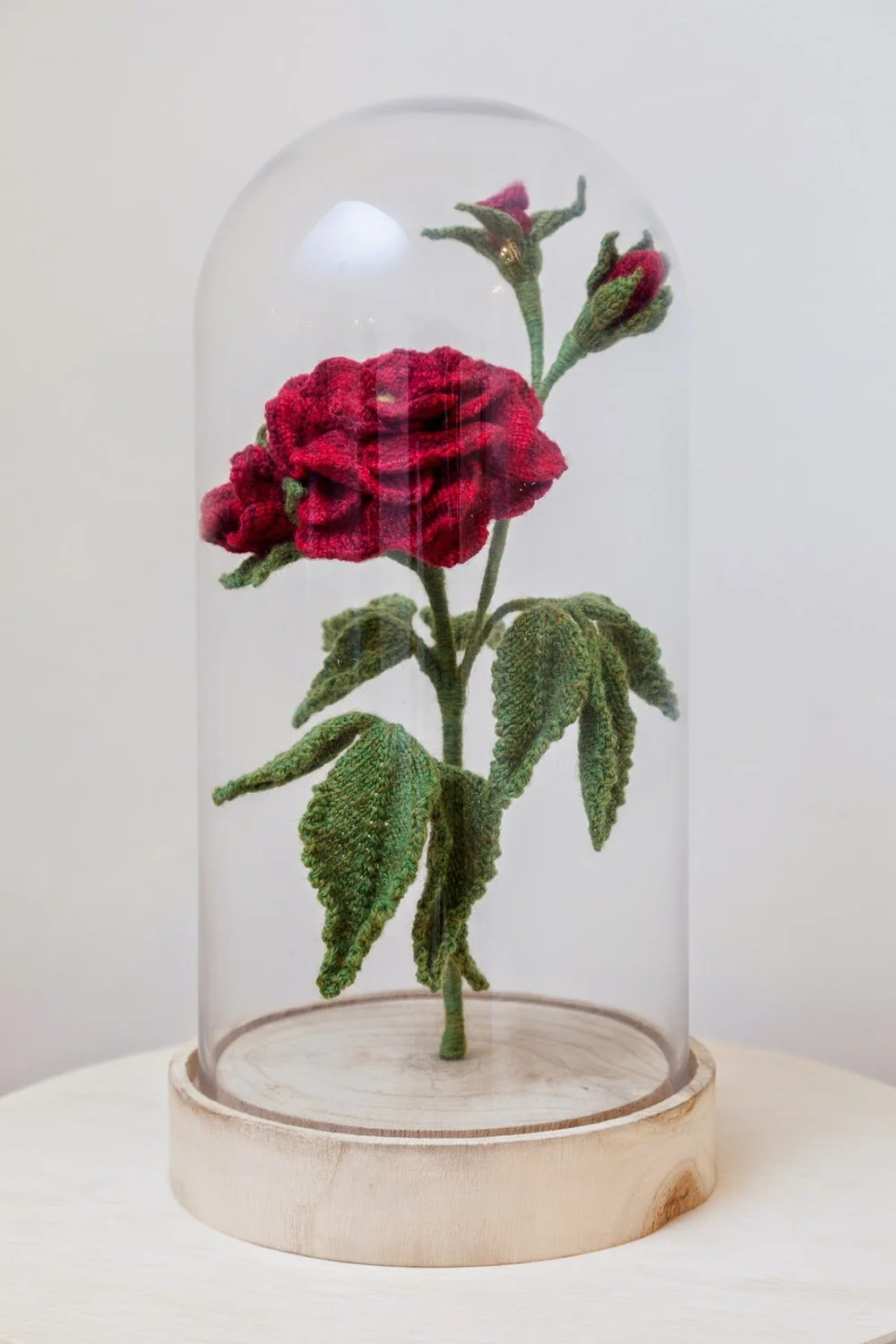 Glass dome with flowers from Victorian knitting pattern