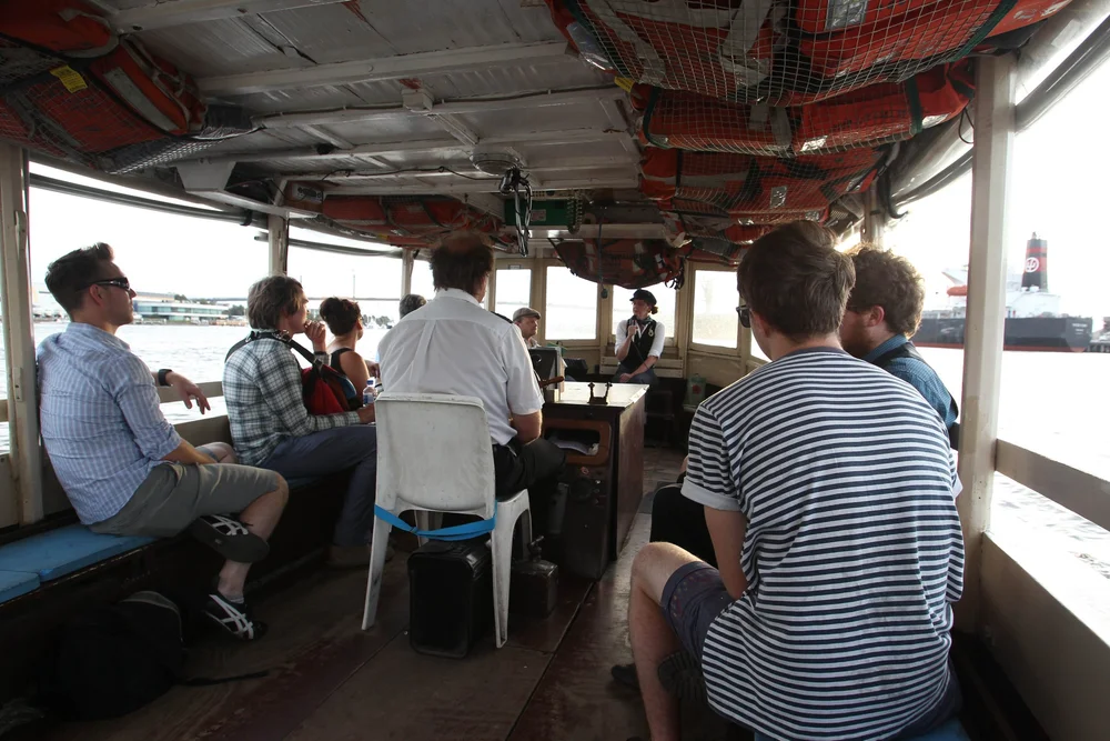 Audience hearing lore about sea shanties and merchant marines