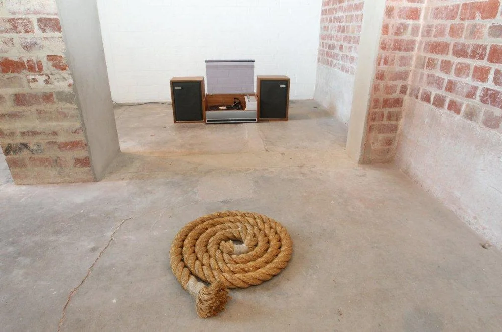 Installation with vintage phonograph playing a sea shanty