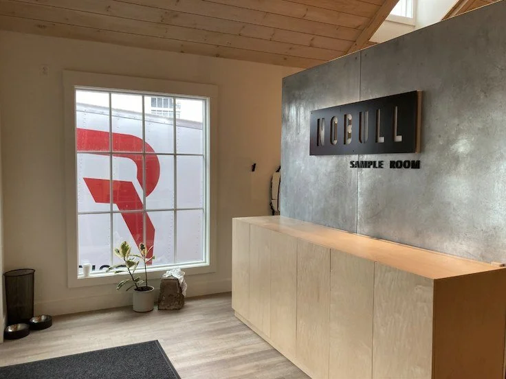 NOBULL — Sample room counter & metal feature wall
