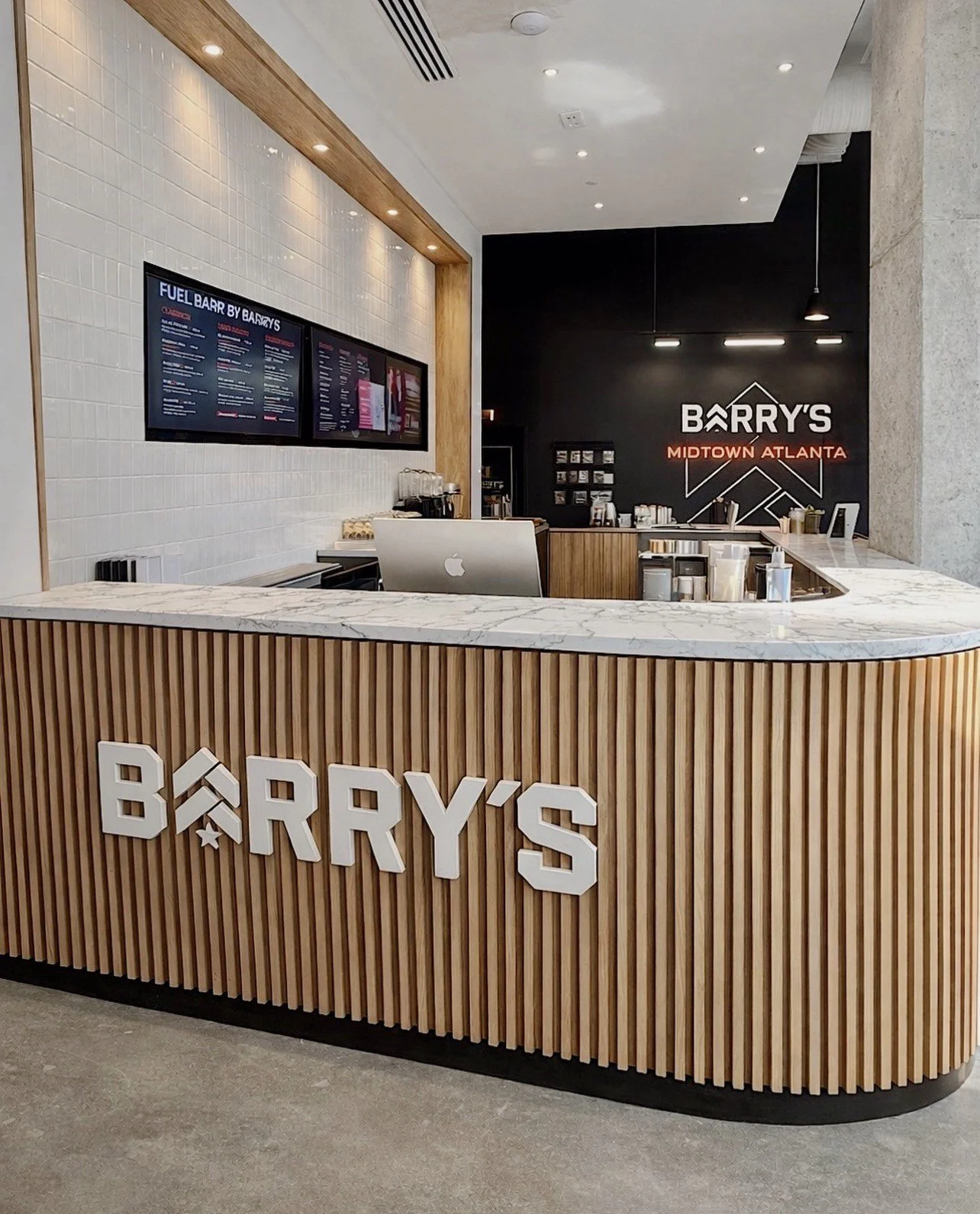 Barry's Midtown Atlanta — Curved slat fuel bar