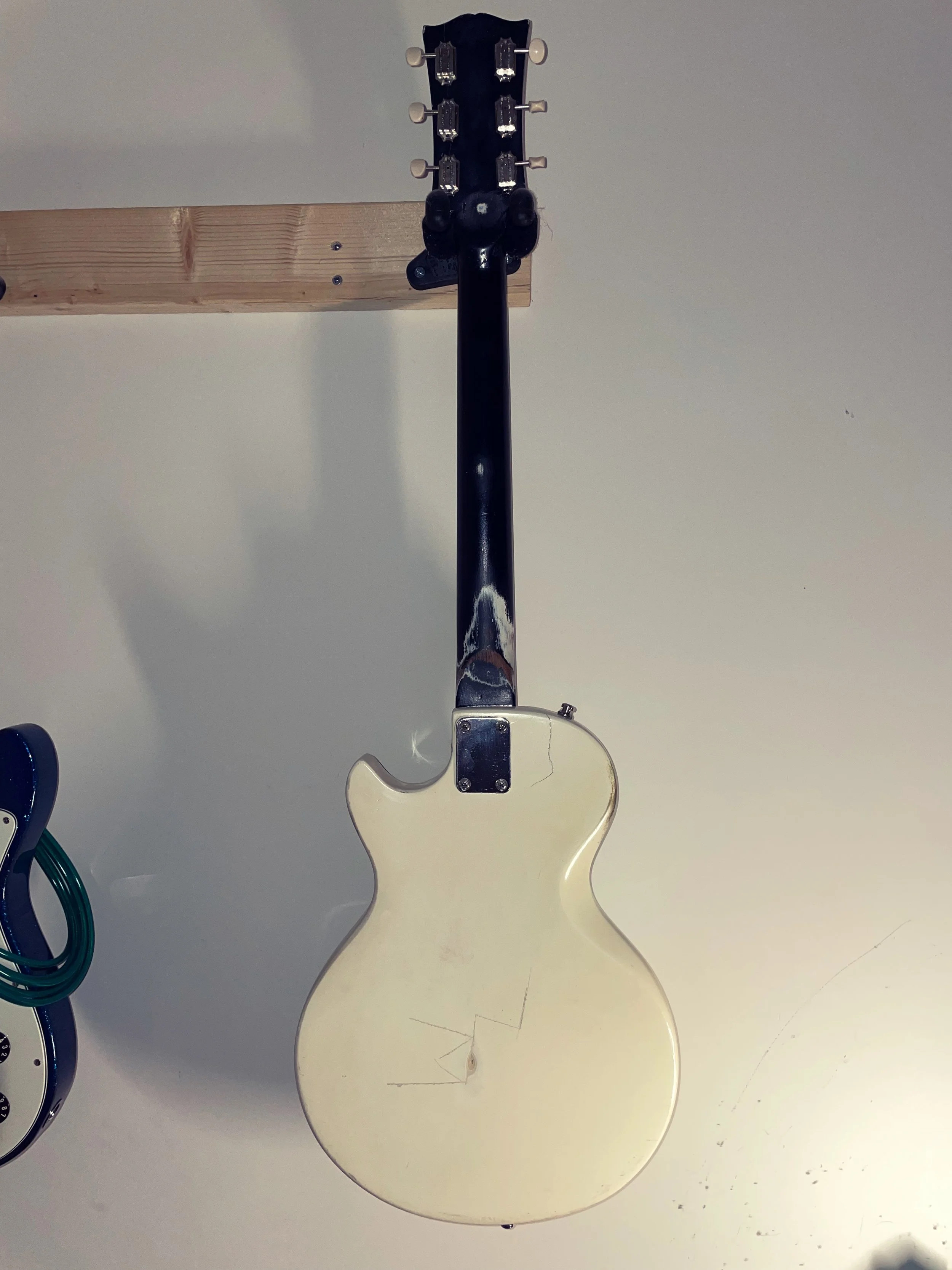 The backs (and fronts) of my beloved 1981 Gibson Sonex and Gretsch Streamliner.

Yes, I sanded the neck to see how many times it&rsquo;d had been painted. Someday when we have more room to work on guitars, I&rsquo;m stripping all that sticky black pa