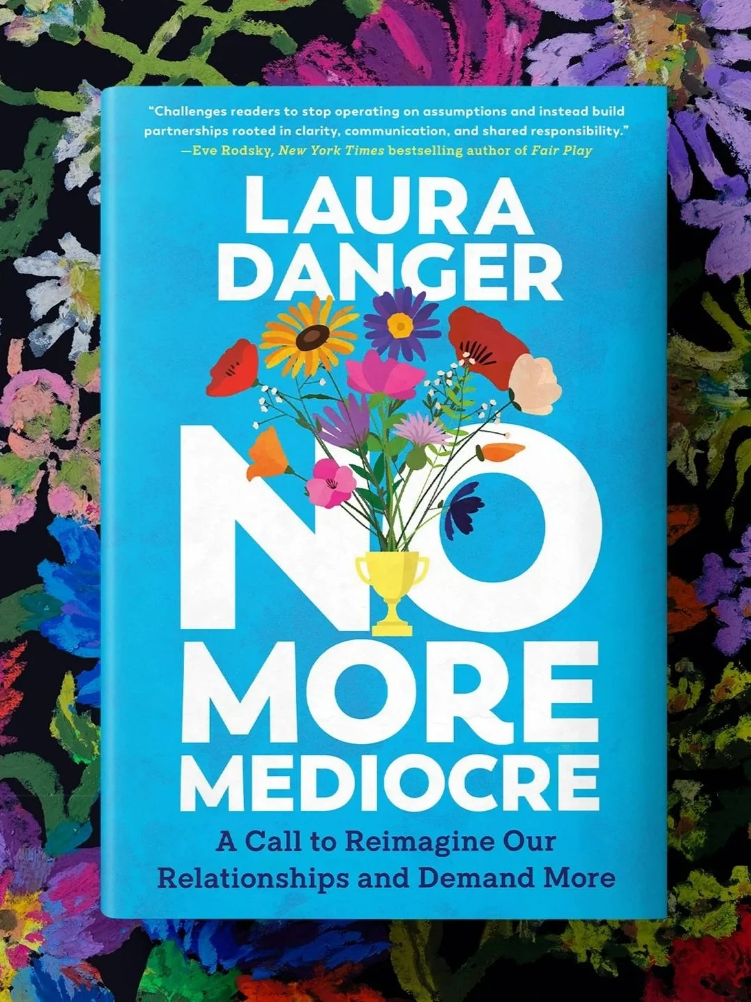 The cover of a book titled 'No More Mediocre' by Laura Danger, with a blue background and an illustration of a flower bouquet in a yellow trophy cup.