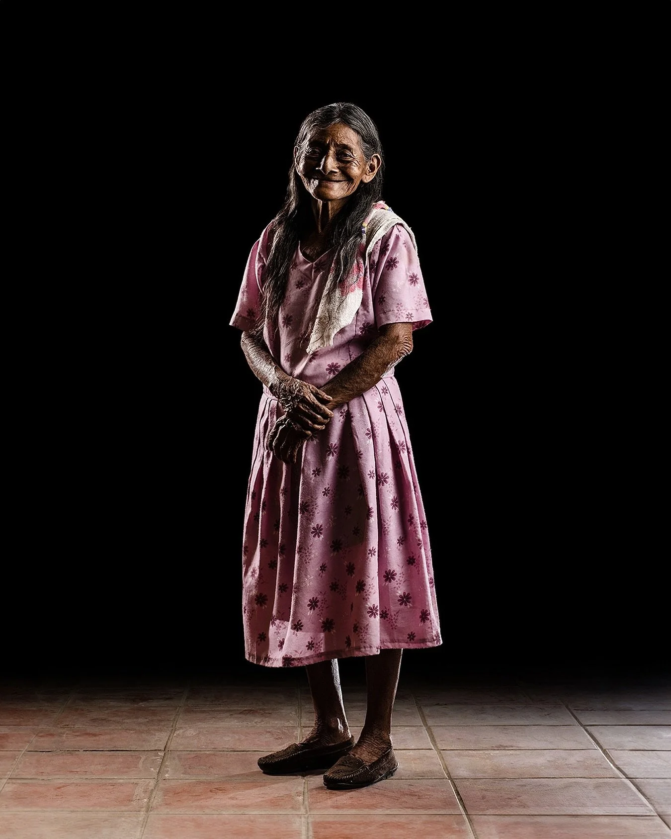 Amidst the slow rhythms of rural life, she flourishes with joy like a wildflower, her resilience blooming brightly with each passing dawn.
