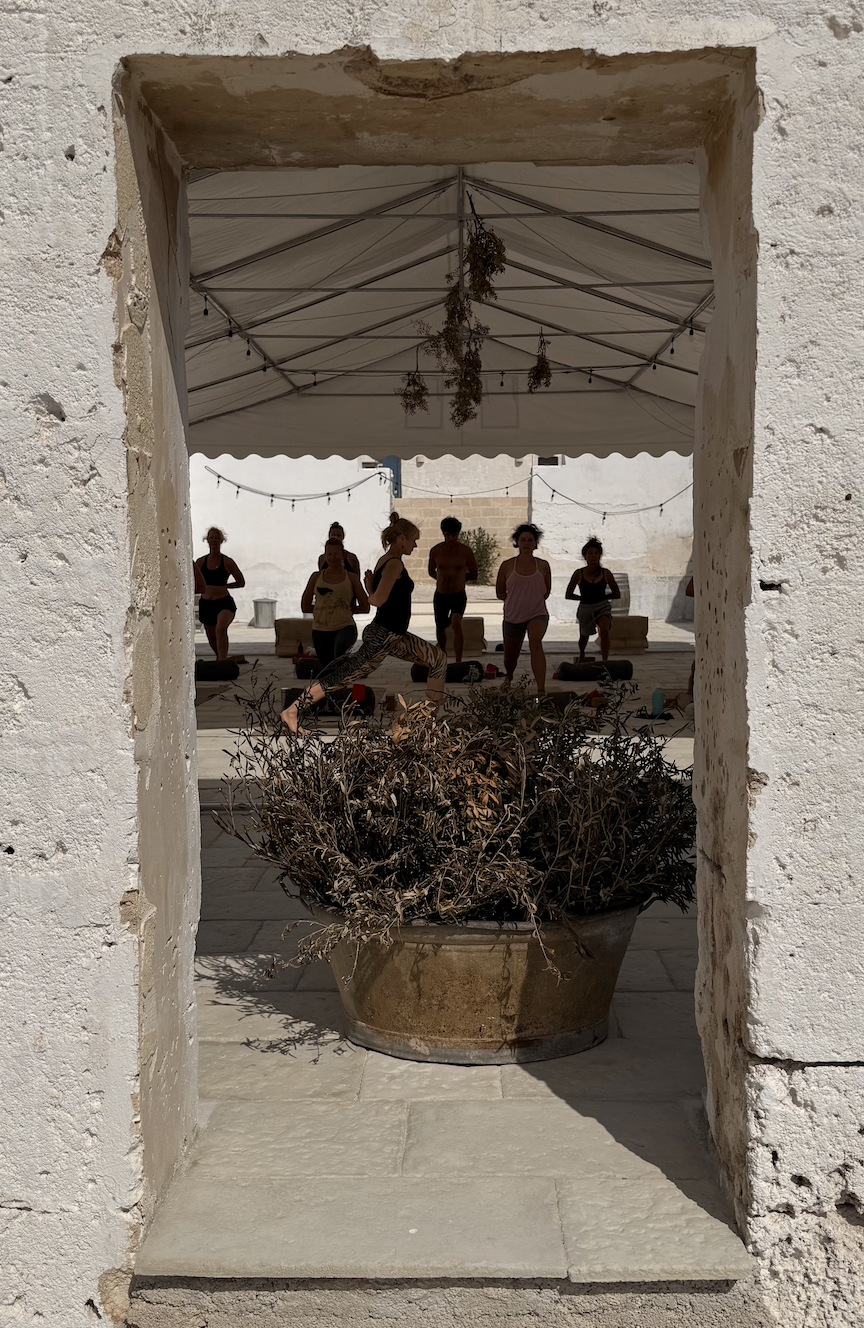 Scenic outdoor yoga space at Masseria Specula surrounded by countryside views, offering a peaceful setting for yoga and wellness retreats in southern Italy