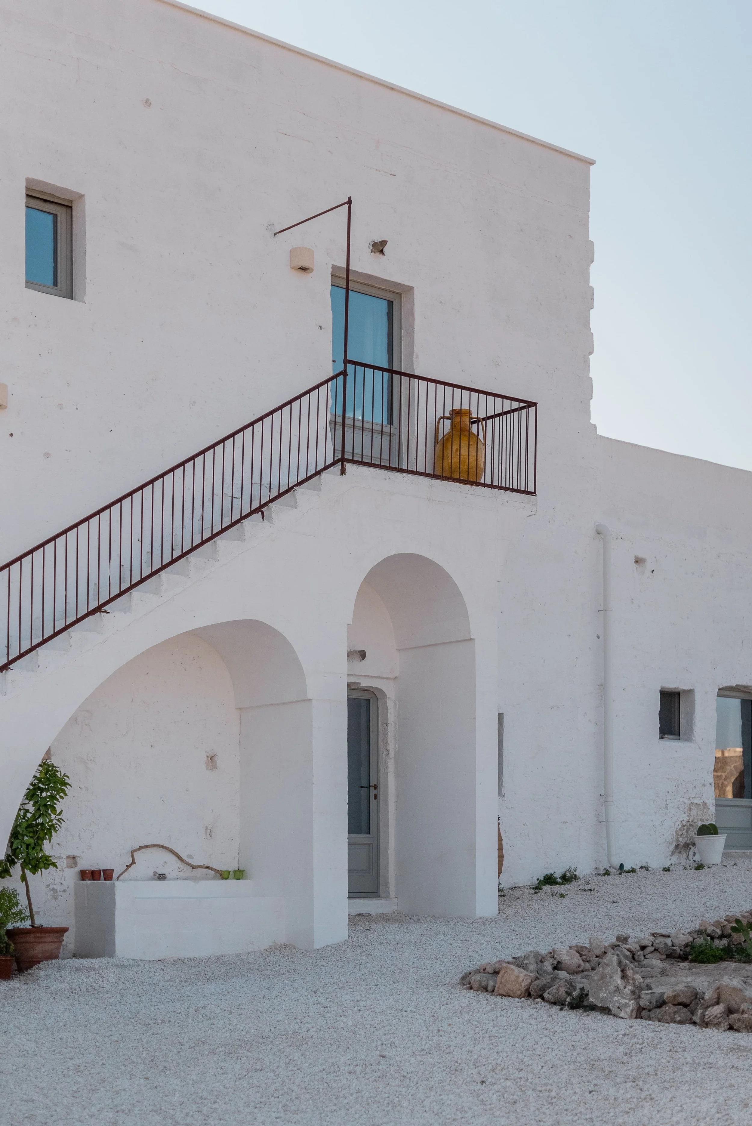 Traditional masseria courtyard with outdoor seating in Southern Italy