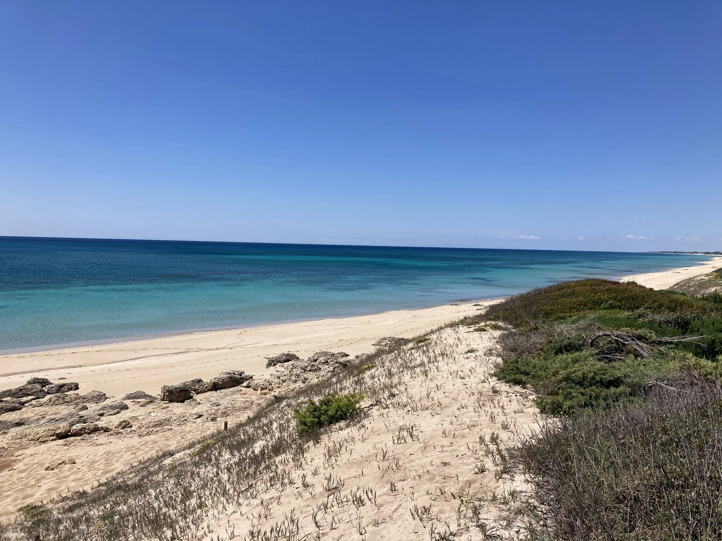 Scenic walking route from Masseria Specula to the nearby beach, highlighting the convenience and natural surroundings of this retreat location in southern Italy