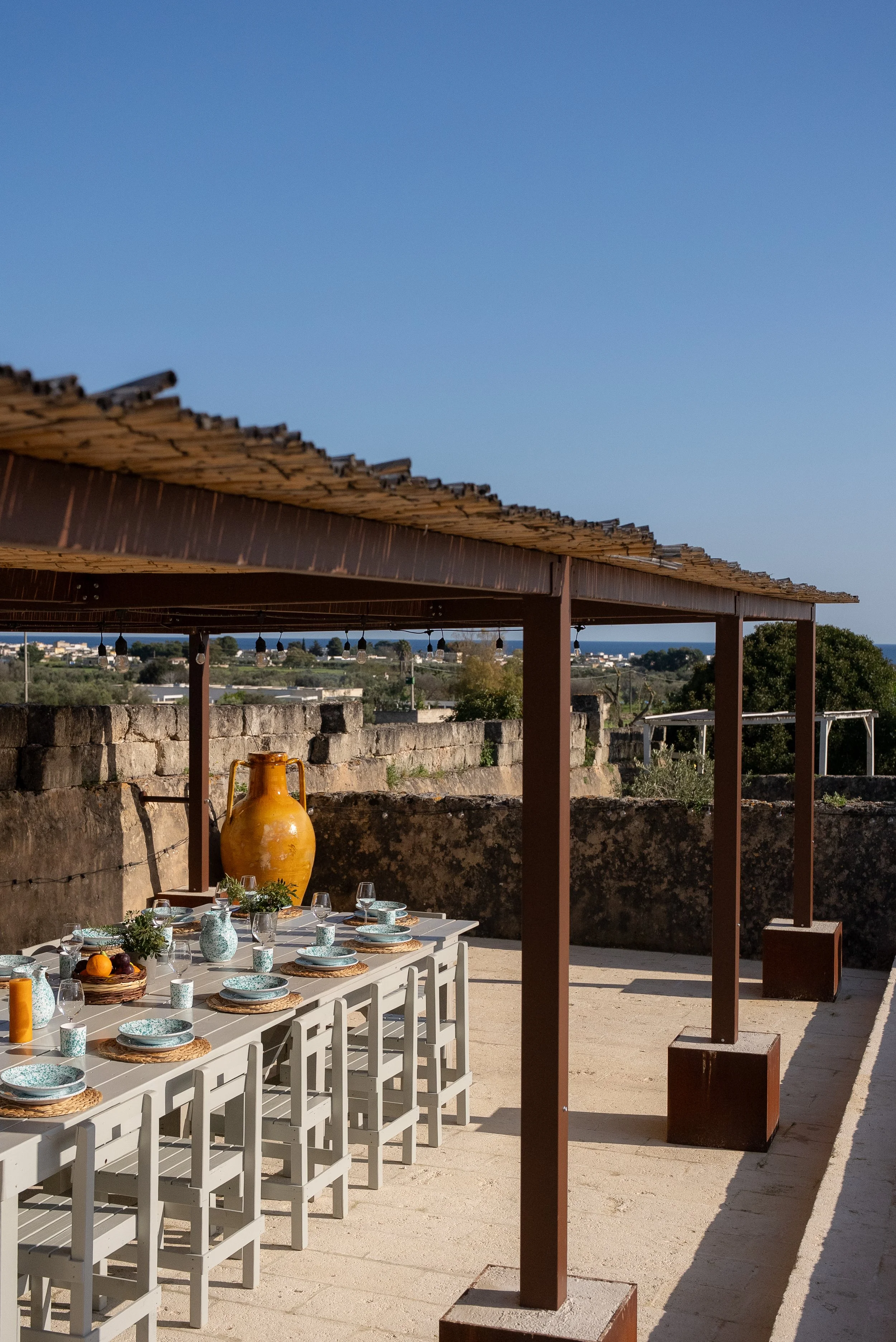 Outdoor dining at sunset at yoga retreat venue in Puglia, Italy
