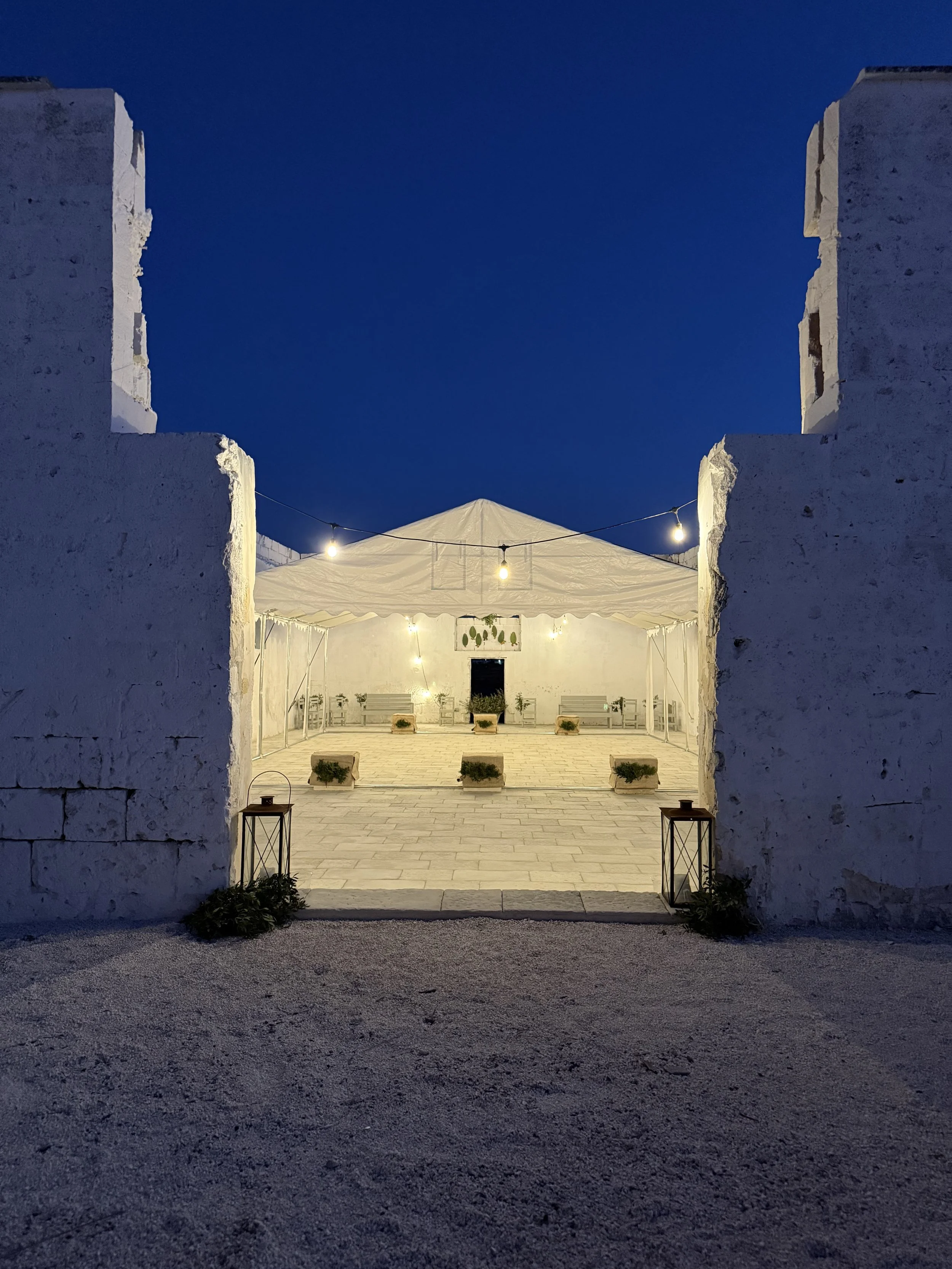Outdoor yoga session at sunset at Masseria Specula, with warm light and serene surroundings creating a relaxing retreat experience in Italy