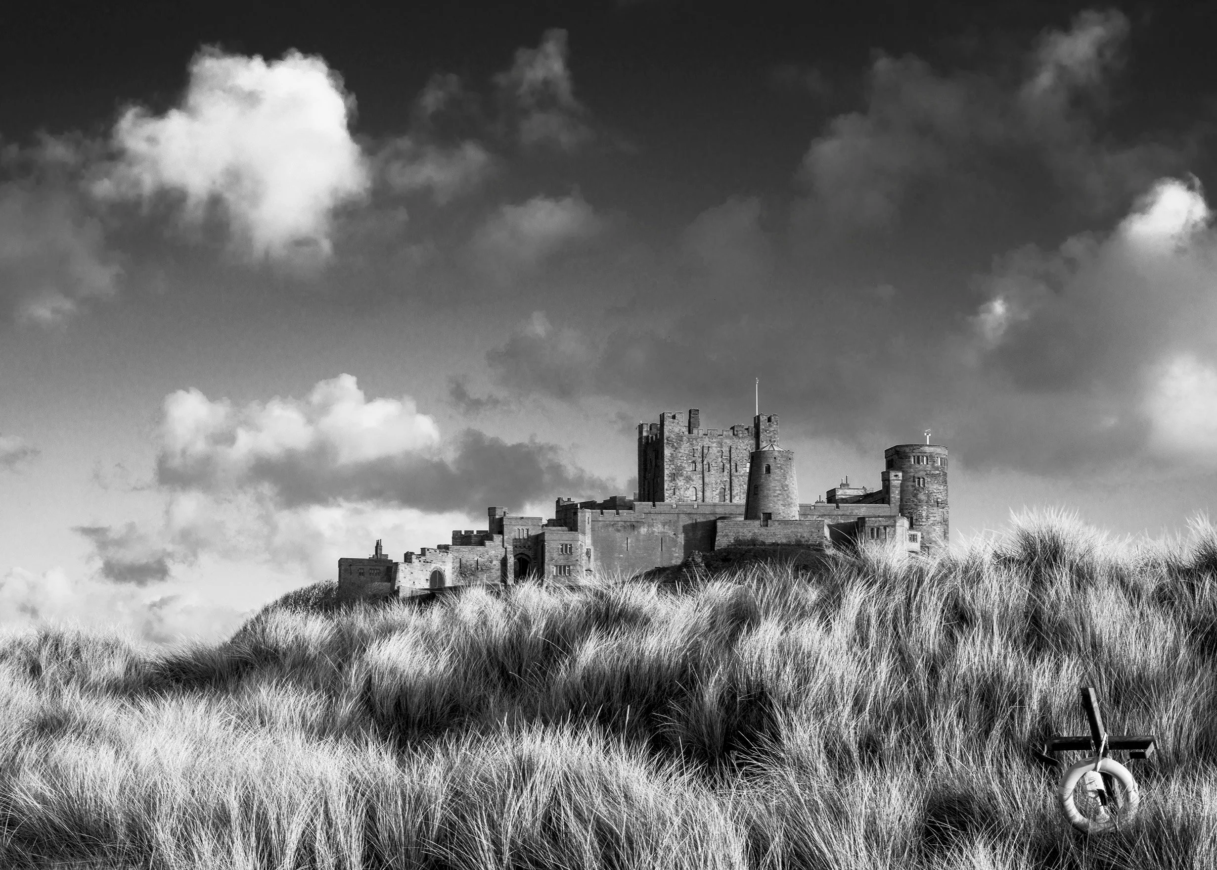 Bamburgh Castle with Dunes + Life Ring.jpg