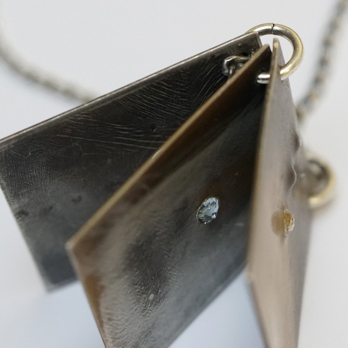 Reckoning Pendant_3 pages_with topaz_11_low res.jpg