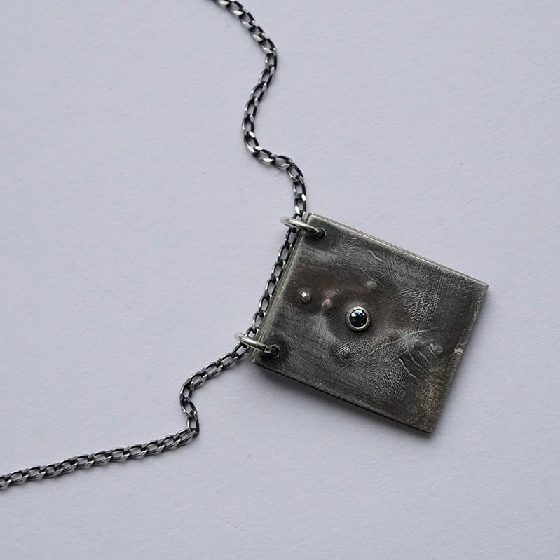 Reckoning+Pendant_3+pages_with+topaz_110_low+res.jpg