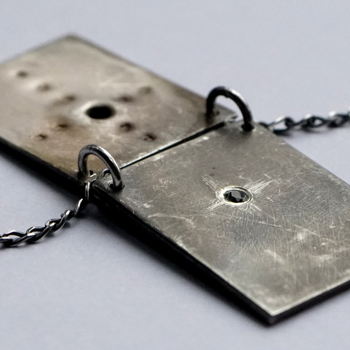 Reckoning Pendant_2 pages_with topaz_3_low res.jpg