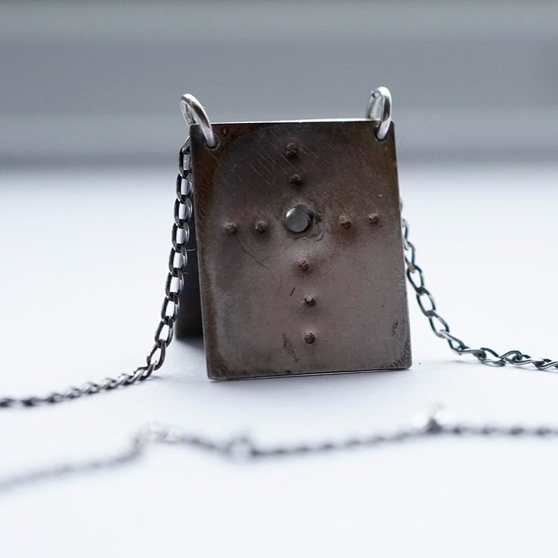 Reckoning+Pendant_2+pages_with+topaz_2_low+res.jpg