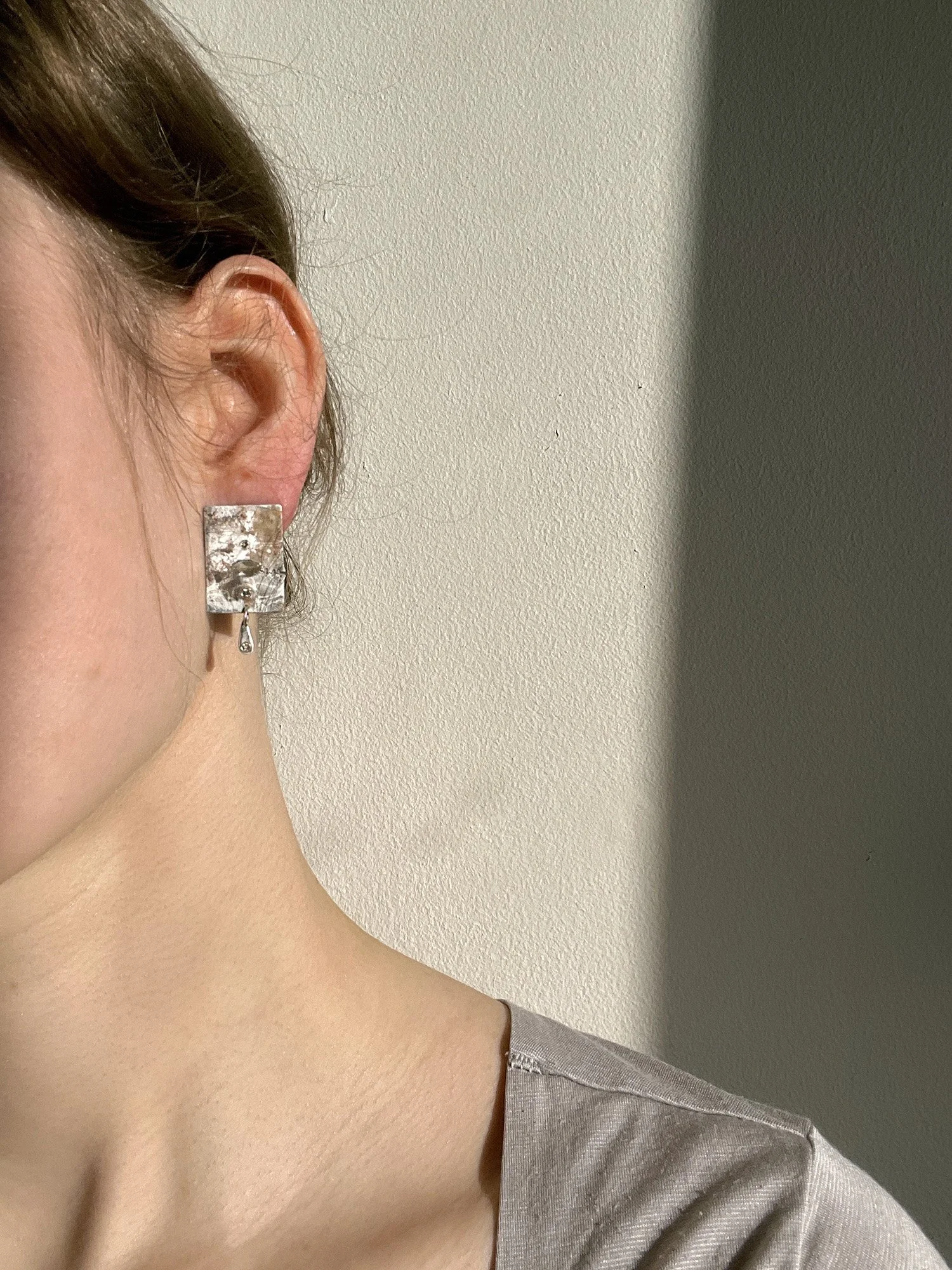 Reconing Earrings model shot.jpg