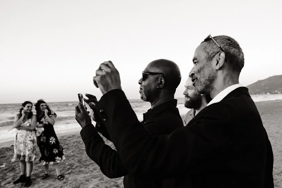 &lsquo;A Click of Photographer&rsquo; - always a joy to come across scenes like this at a wedding. A photograph that makes my inner photographer heart skip. 

#monochrome #blackandwhitephotography #weddingguest #cretewedding #beachwedding #rethymno #