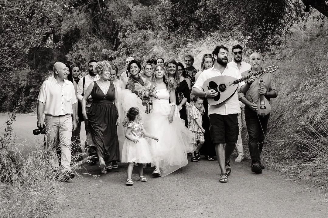 Here comes the bride - sometimes the simplest photos are the best. Love that everyone is smiling. #documentaryweddingphotographer #monochrome #weddingphotography #weddinginspiration #creteweddings