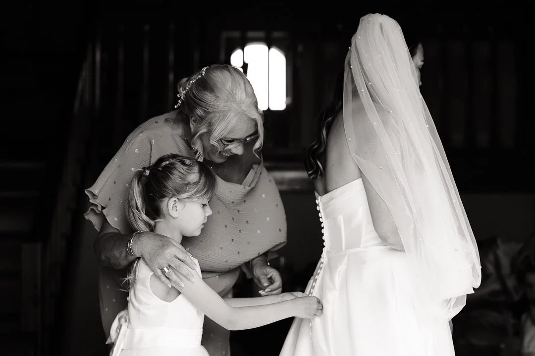 A helping hand - wedding dresses are easier to do up with small hands.  Last wedding of the season today. So glad the weather has decided to play ball. 

#blackandwhitephotography #weddingday #documentaryweddingphotography #cretewedding #monochrome