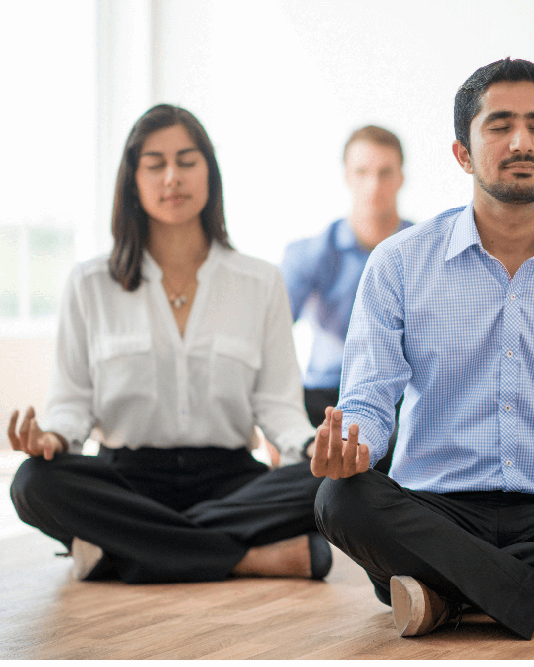 Corporate workers meditating
