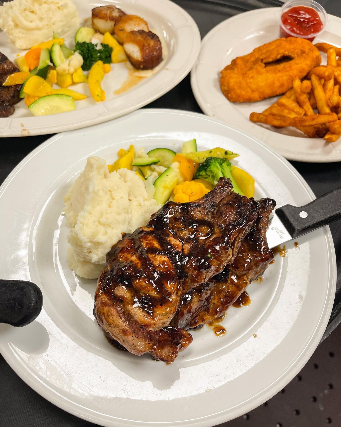 Grilled Pork Chops @westside_grill 🤩 (honorable mention to our Kid&rsquo;s Chicken Tenders and Steak &amp; Scallops in the background)