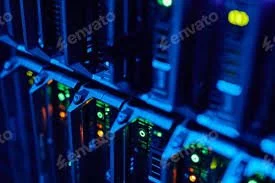 A rack of servers is lined up neat and tidy, under blue lighting