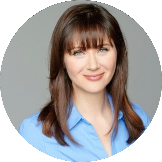 Julie Daniluk, TV Host and Best selling author headshot wearing a light blue collared shirt, smiling against a gray background.