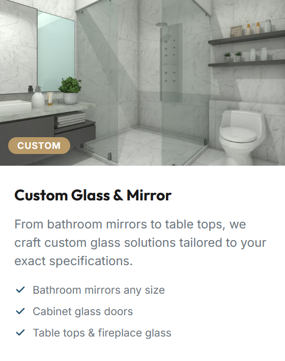 Modern bathroom with marble walls and floor, glass shower enclosure, wall-mounted mirror, towel shelf, and a toilet.