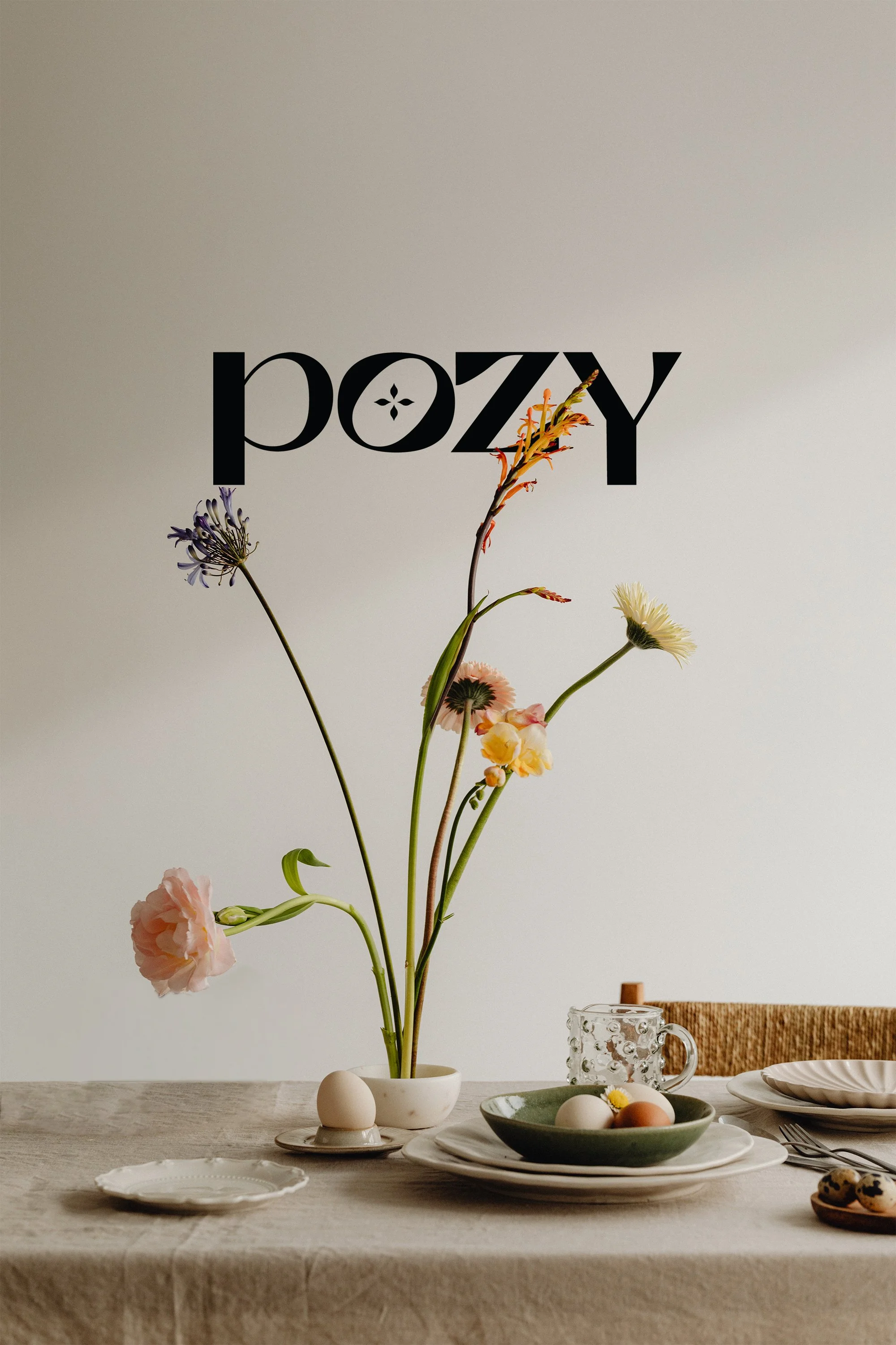 Trendy flowers sitting on table with flower shop logo behind
