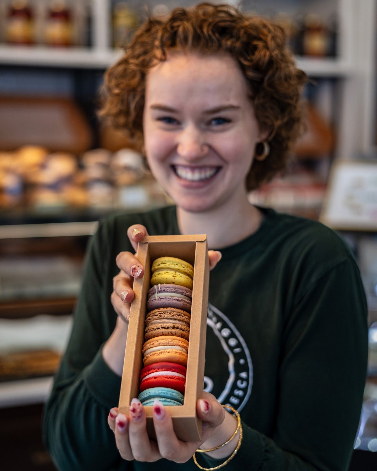 Macarons galore ✨ Yara showcasing our delightful assortment | A rainbow of colours and flavours waiting to be savoured 🌈 ⁠
⁠
Which one will you choose? 🍡