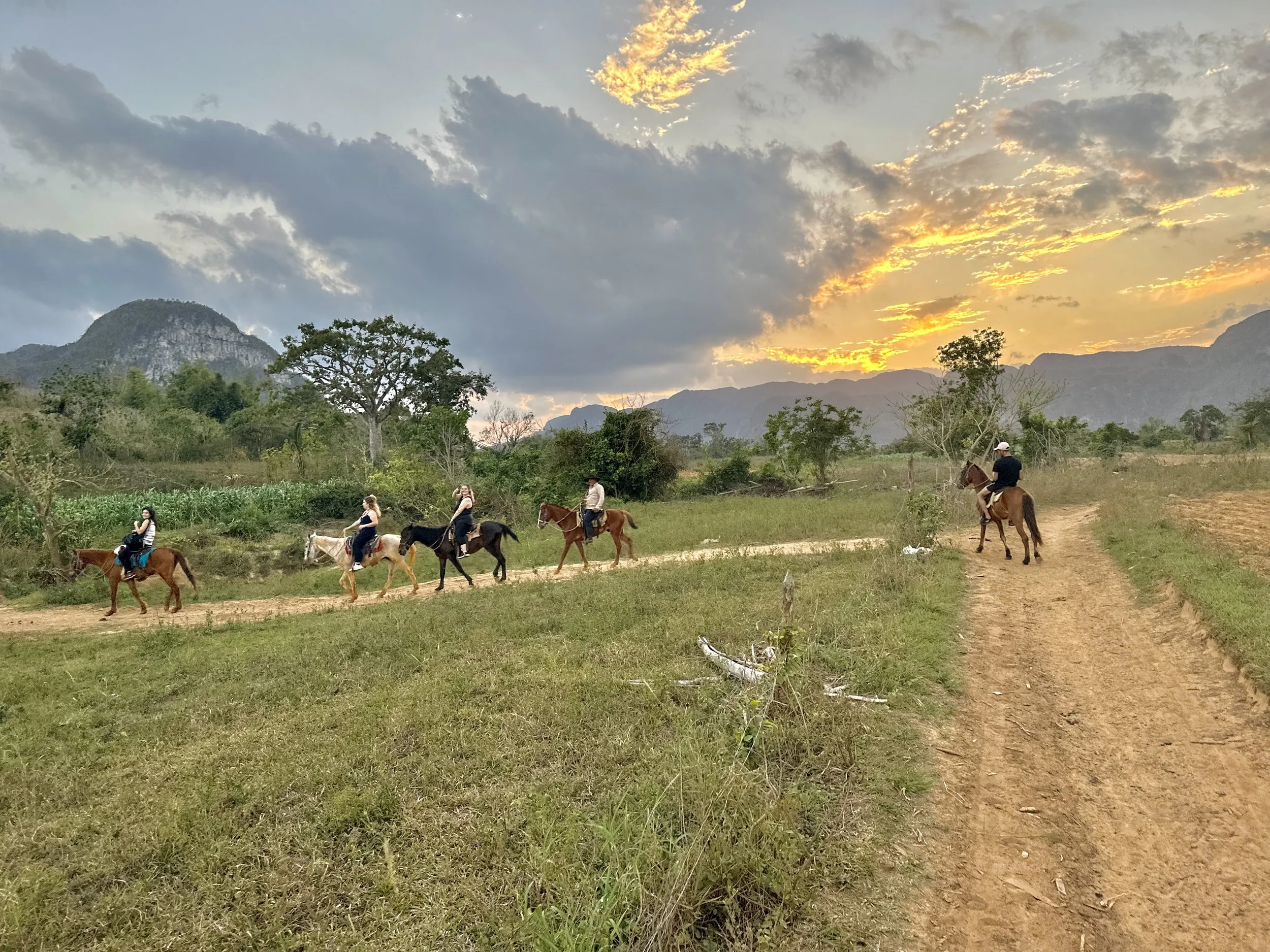 Group of people horsebacking through Cuba.