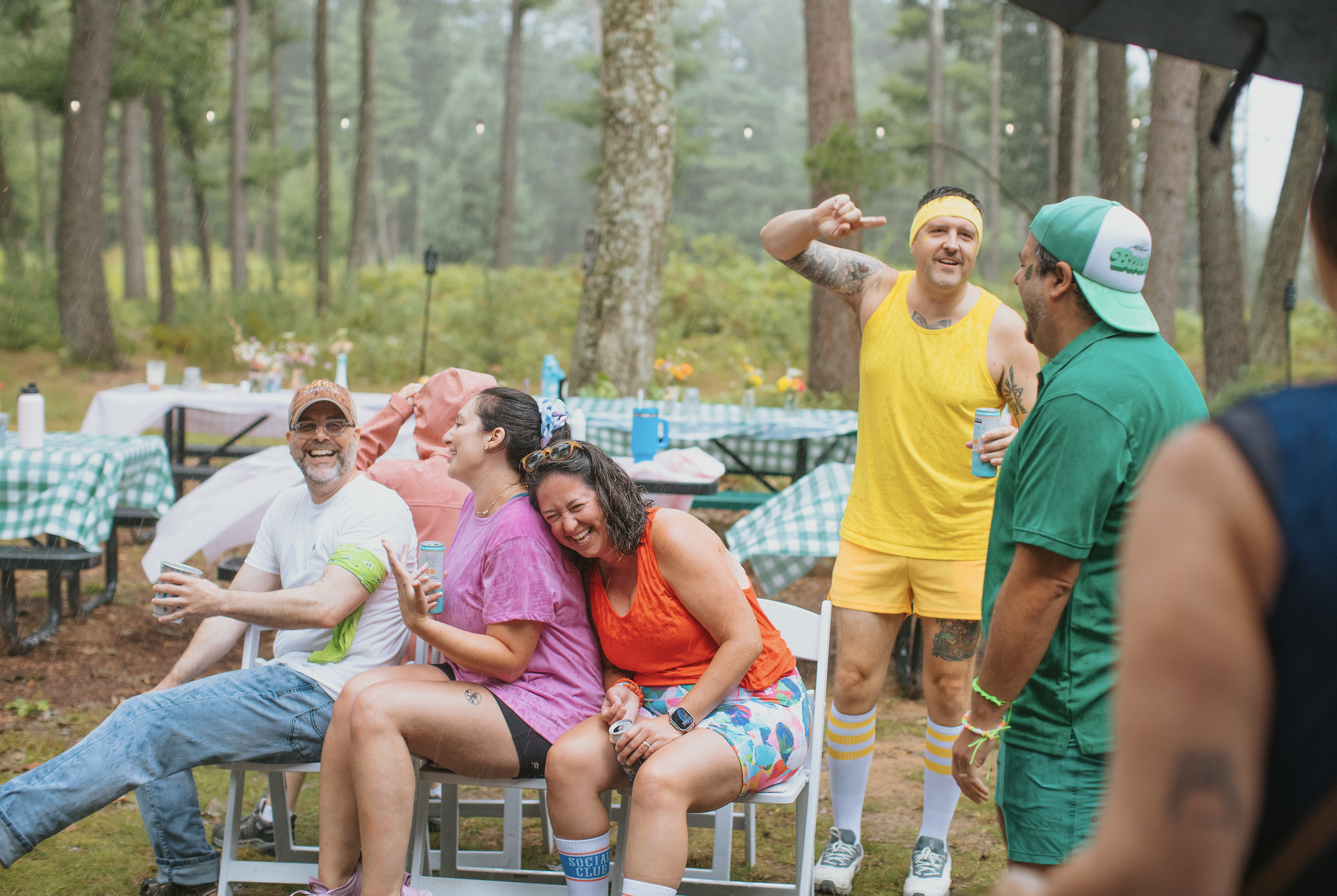 Campers playing musical chairs at Camp Lola Whiskey in Wisconsin's Northwoods — a highlight of any Midwest summer bucket list.